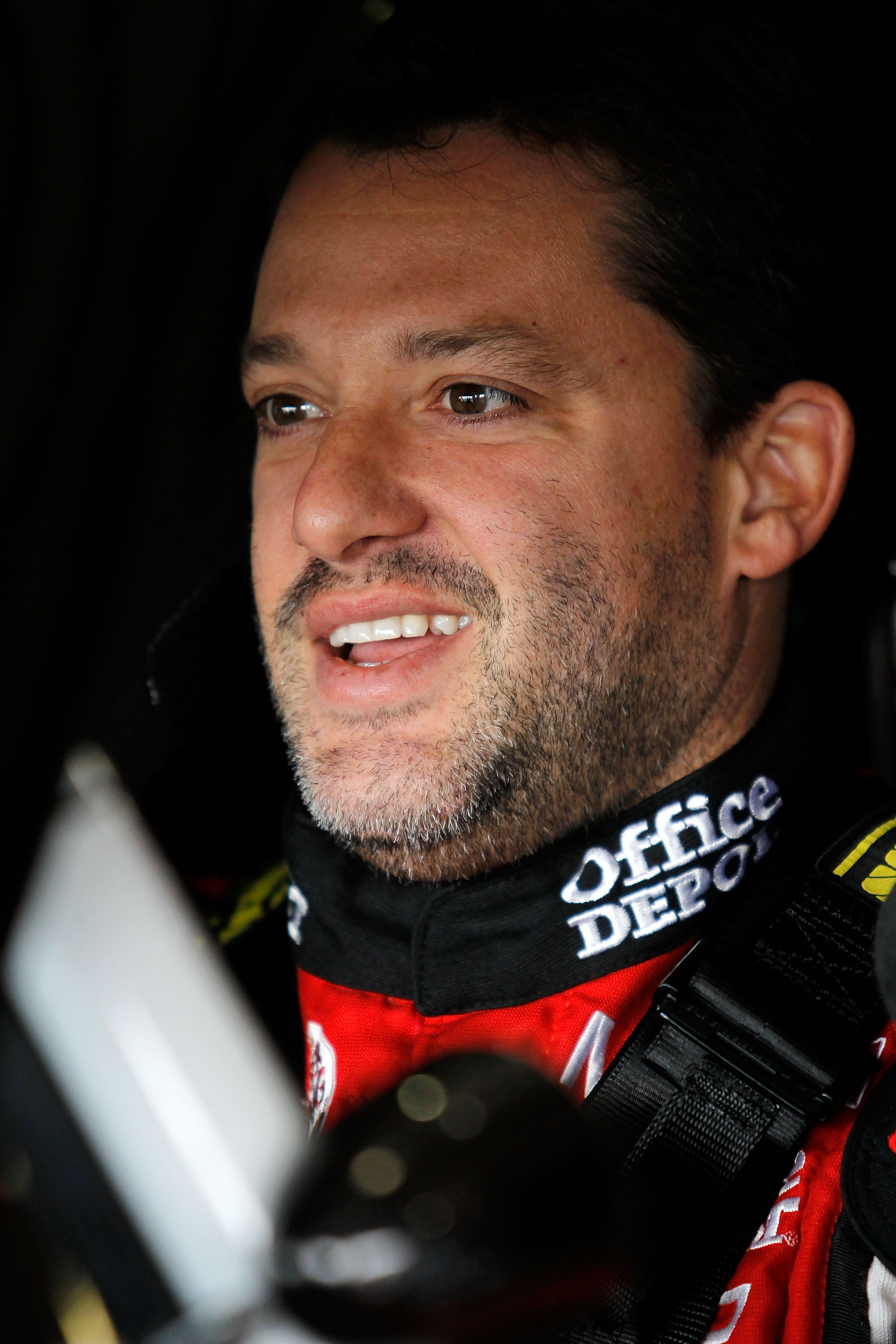 FONTANA, CA - MARCH 26:  Tony Stewart, driver of the #14 Office Depot/Mobil 1 Chevrolet, sits in his car during practice for the NASCAR Sprint Cup Series Auto Club 400 at Auto Club Speedway on March 26, 2011 in Fontana, California.  (Photo by Todd Warshaw