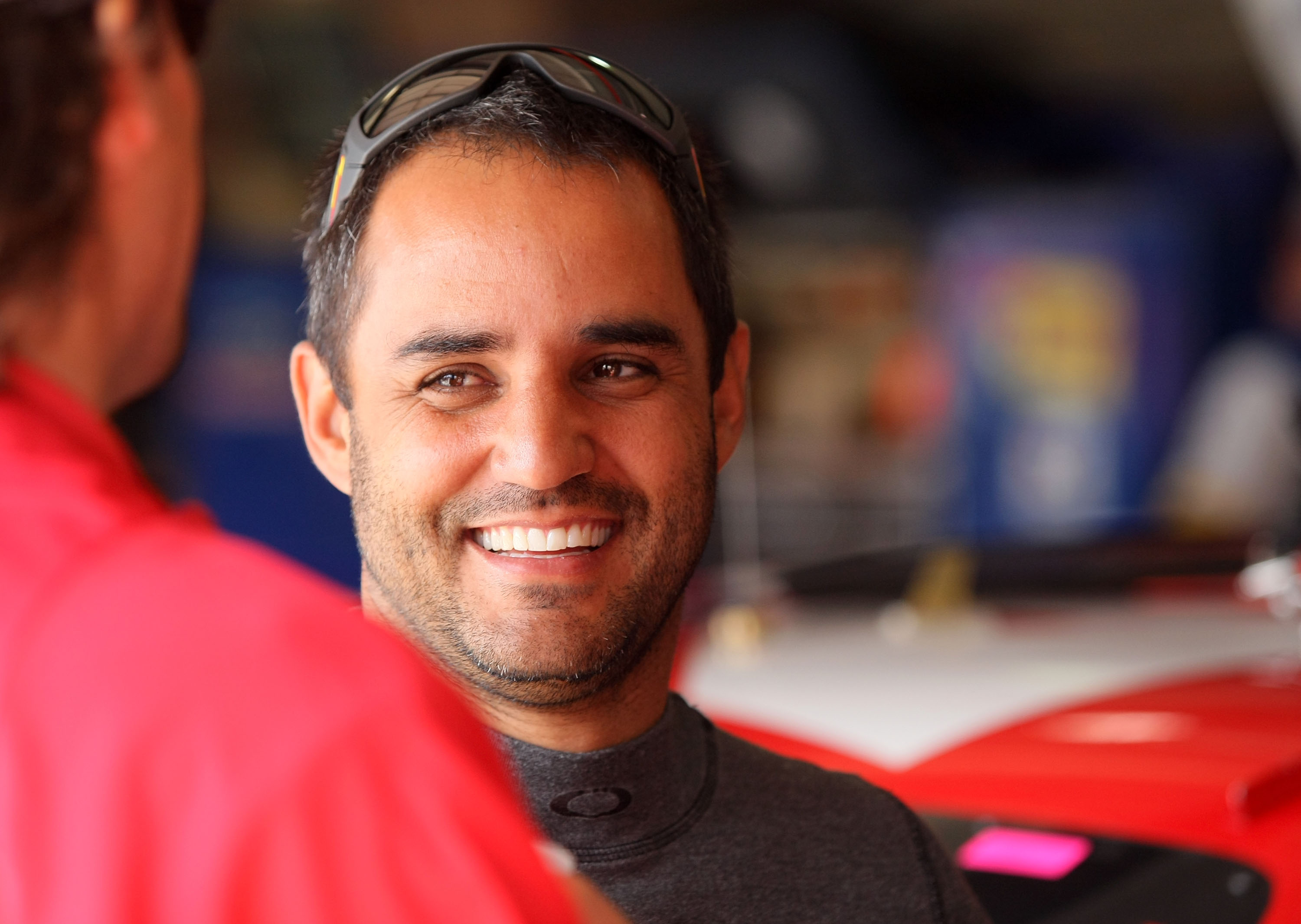 FONTANA, CA - MARCH 26:  Juan Pablo Montoya, driver of the #42 Target Chevrolet, stands in the garage area during practice for the NASCAR Sprint Cup Series Auto Club 400 at Auto Club Speedway on March 26, 2011 in Fontana, California.  (Photo by Victor Dec