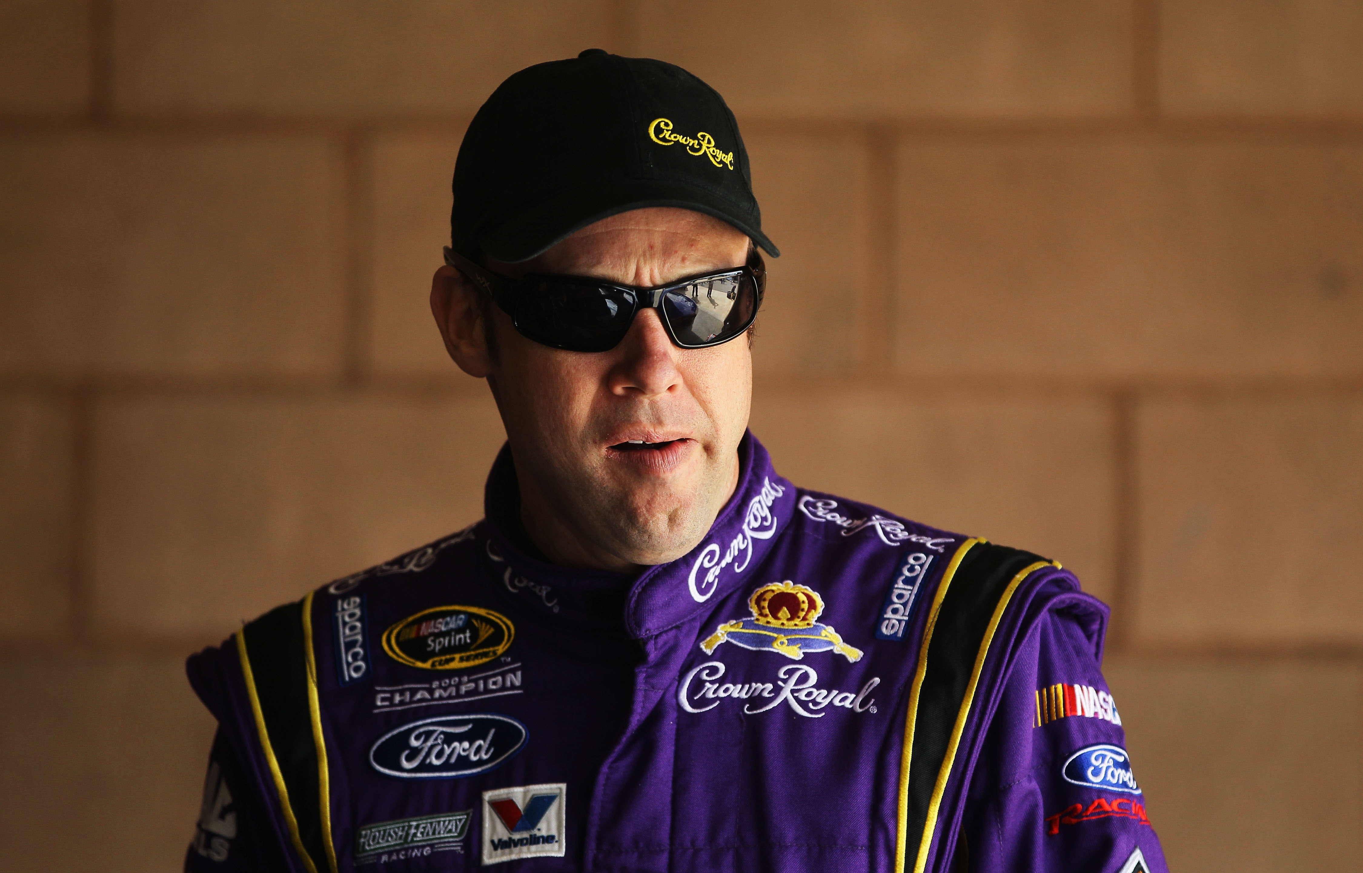 FONTANA, CA - MARCH 26:  Matt Kenseth, driver of the #17 Crown Royal Ford, stands in the garage area during practice for the NASCAR Sprint Cup Series Auto Club 400 at Auto Club Speedway on March 26, 2011 in Fontana, California.  (Photo by Jeff Gross/Getty