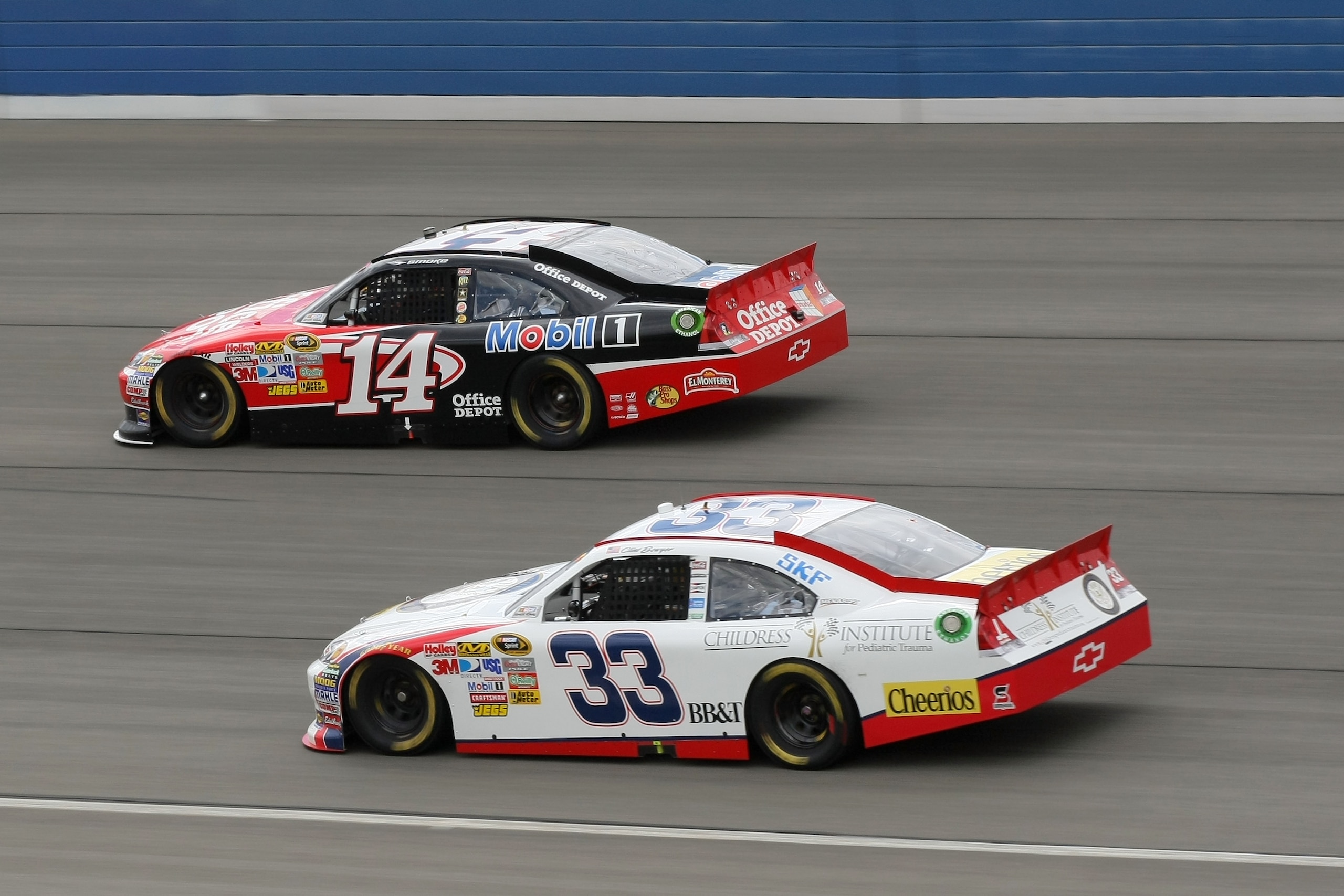 FONTANA, CA - MARCH 27: Tony Stewart, driver of the #14 Office Depot/Mobil 1 Chevrolet, leads Clint Bowyer, driver of the #33 Ronald Regan Foundation Chevrolet, during the NASCAR Sprint Cup Series Auto Club 400 at Auto Club Speedway on March 27, 2011 in FONTANA, CA - MARCH 27: Tony Stewart, driver of the #14 Office Depot/Mobil 1 Chevrolet, leads Clint Bowyer, driver of the #33 Ronald Regan Foundation Chevrolet, during the NASCAR Sprint Cup Series Auto Club 400 at Auto Club Speedway on March 27, 2011 in