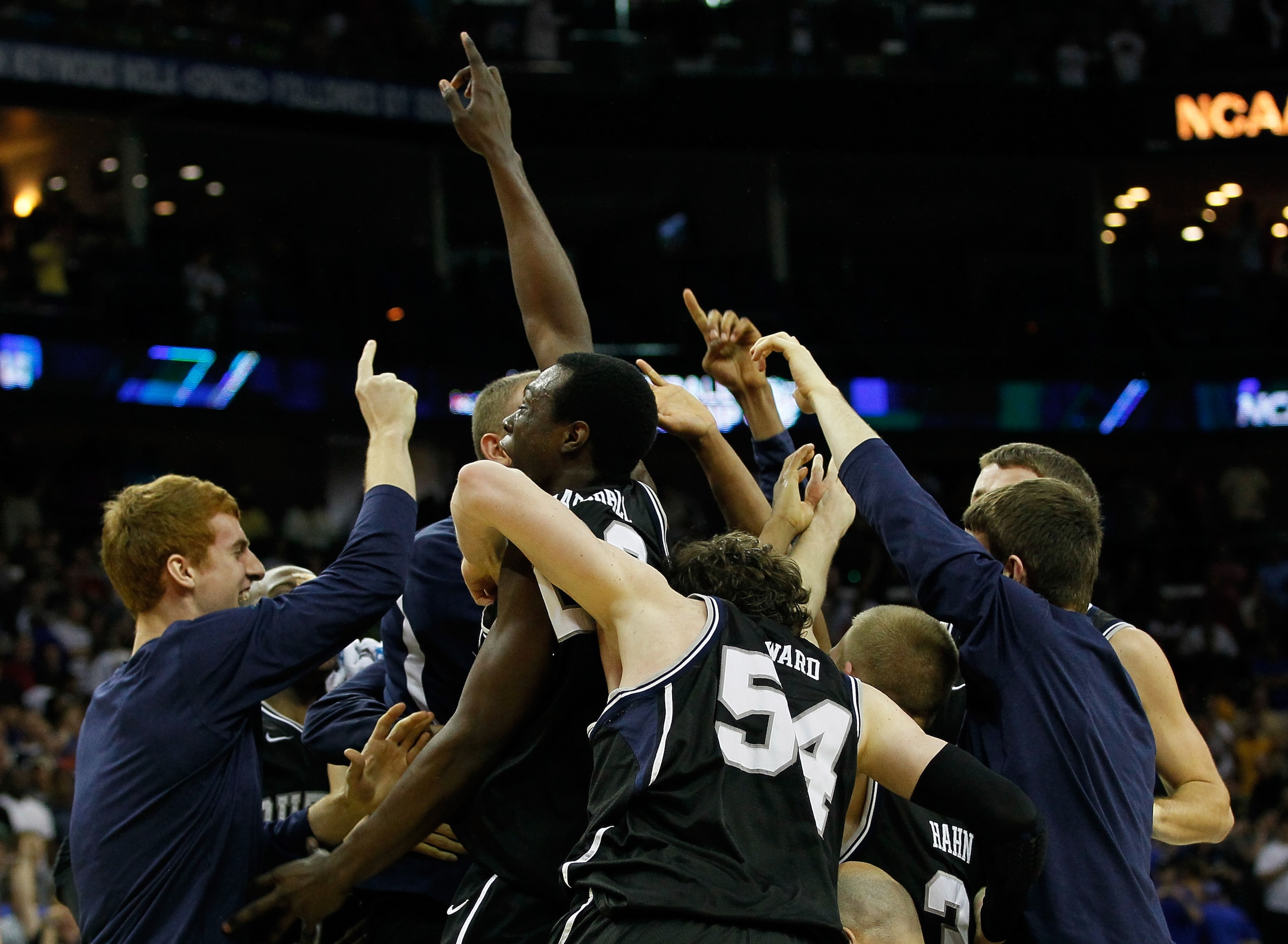 NEW ORLEANS, LA - MARCH 26:  The Butler Bulldogs celebrate after defeating the Florida Gators 74 to 71 in overtime during the Southeast regional final of the 2011 NCAA men's basketball tournament at New Orleans Arena on March 26, 2011 in New Orleans, Loui