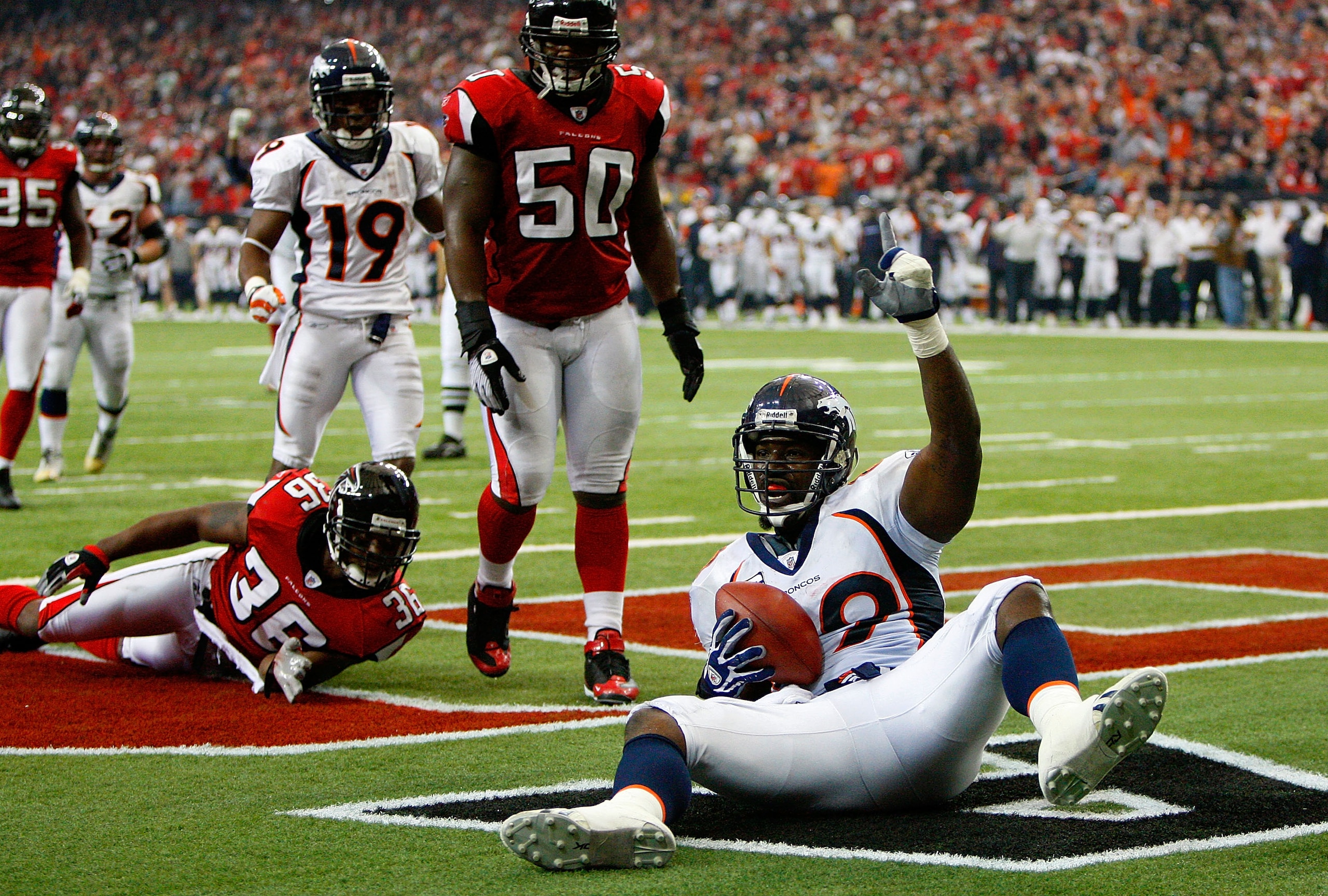 ATLANTA - NOVEMBER 16: Tight end Daniel Graham #89 of the Denver Broncos reacts after scoring the game-winning touchdown against Lawyer Milloy #36 and Curtis Lofton #50 of the Atlanta Falcons during the game at the Georgia Dome on November 16, 2008 in At ATLANTA - NOVEMBER 16: Tight end Daniel Graham #89 of the Denver Broncos reacts after scoring the game-winning touchdown against Lawyer Milloy #36 and Curtis Lofton #50 of the Atlanta Falcons during the game at the Georgia Dome on November 16, 2008 in At