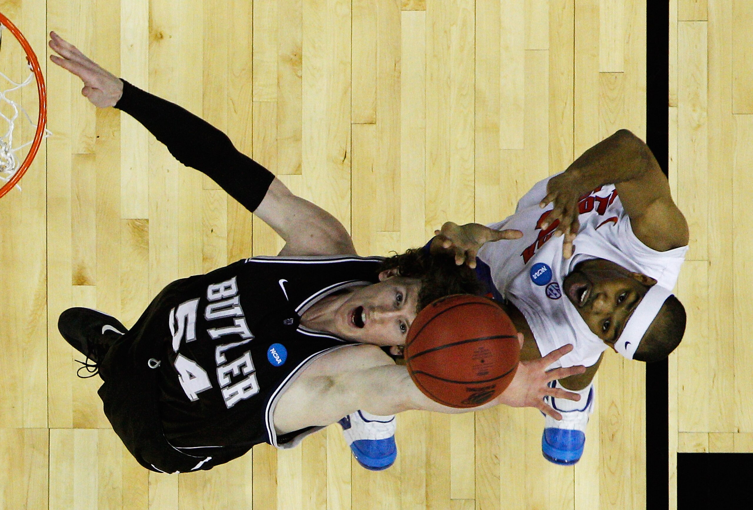 NEW ORLEANS, LA - MARCH 26:  Matt Howard #54 of the Butler Bulldogs goes up against Alex Tyus #23 of the Florida Gators during the Southeast regional final of the 2011 NCAA men's basketball tournament at New Orleans Arena on March 26, 2011 in New Orleans,