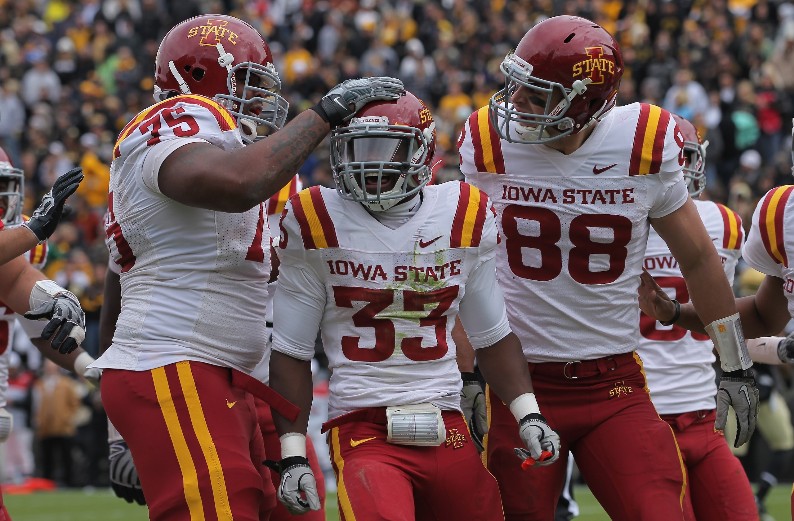 BOULDER, CO - NOVEMBER 13: Alexander Robinson #33 of the Iowa State Cyclones celebrates his eight yard touchdown run in the second quarter with his teammates against the Colorado Buffaloes at Folsom Field on November 13, 2010 in Boulder, Colorado. Colora BOULDER, CO - NOVEMBER 13: Alexander Robinson #33 of the Iowa State Cyclones celebrates his eight yard touchdown run in the second quarter with his teammates against the Colorado Buffaloes at Folsom Field on November 13, 2010 in Boulder, Colorado. Colora