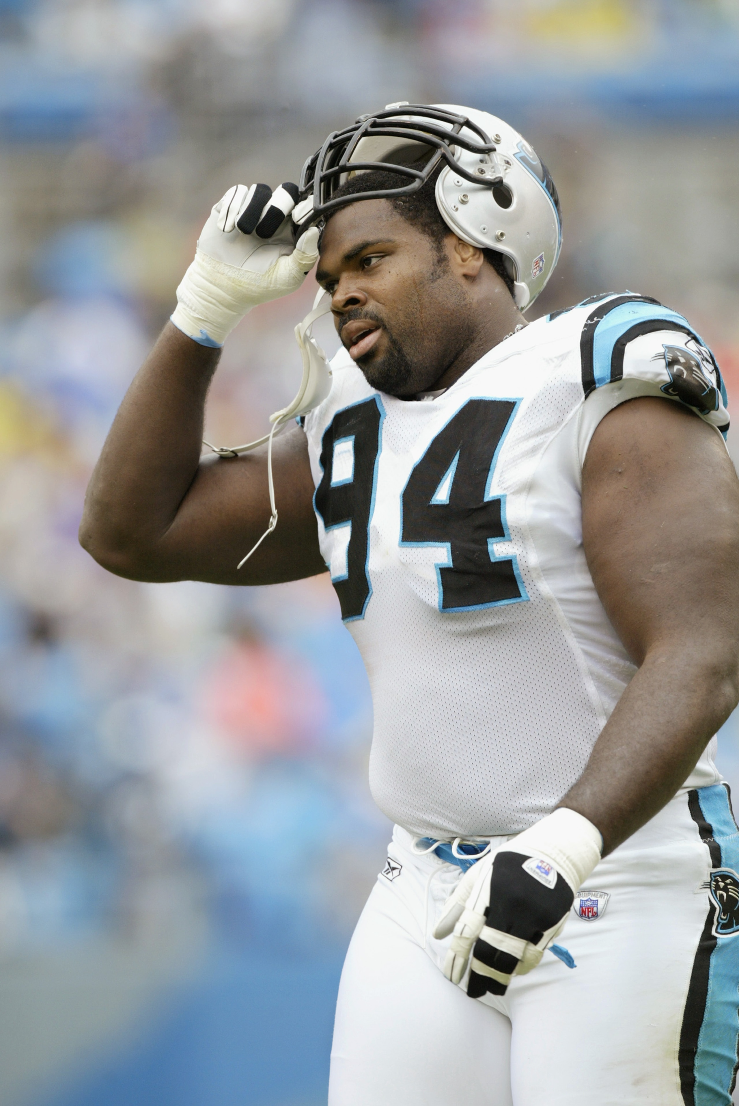 CHARLOTTE, NC - SEPTEMBER 15: Defensive tackle Sean Gilbert #94 of the Carolina Panthers takes his helmet off before the NFL game against the Detroit Lions at Ericsson Stadium on September 15, 2002 in Charlotte, North Carolina. The Panthers won 31-7. (Ph CHARLOTTE, NC - SEPTEMBER 15: Defensive tackle Sean Gilbert #94 of the Carolina Panthers takes his helmet off before the NFL game against the Detroit Lions at Ericsson Stadium on September 15, 2002 in Charlotte, North Carolina. The Panthers won 31-7. (Ph
