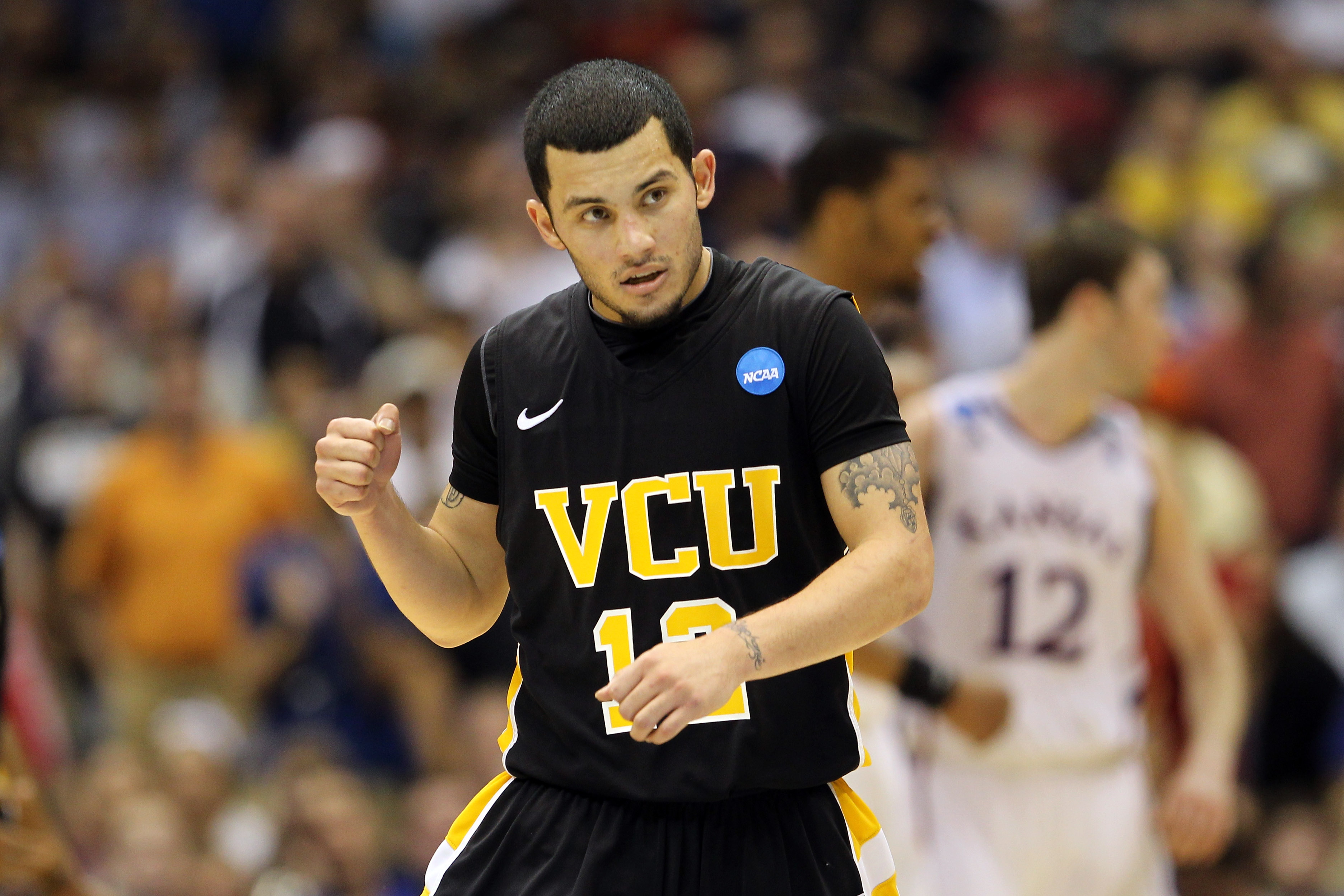 SAN ANTONIO, TX - MARCH 27: Joey Rodriguez #12 of the Virginia Commonwealth Rams celebrates after a play against the Kansas Jayhawks during the southwest regional final of the 2011 NCAA men's basketball tournament at the Alamodome on March 27, 2011 in Sa