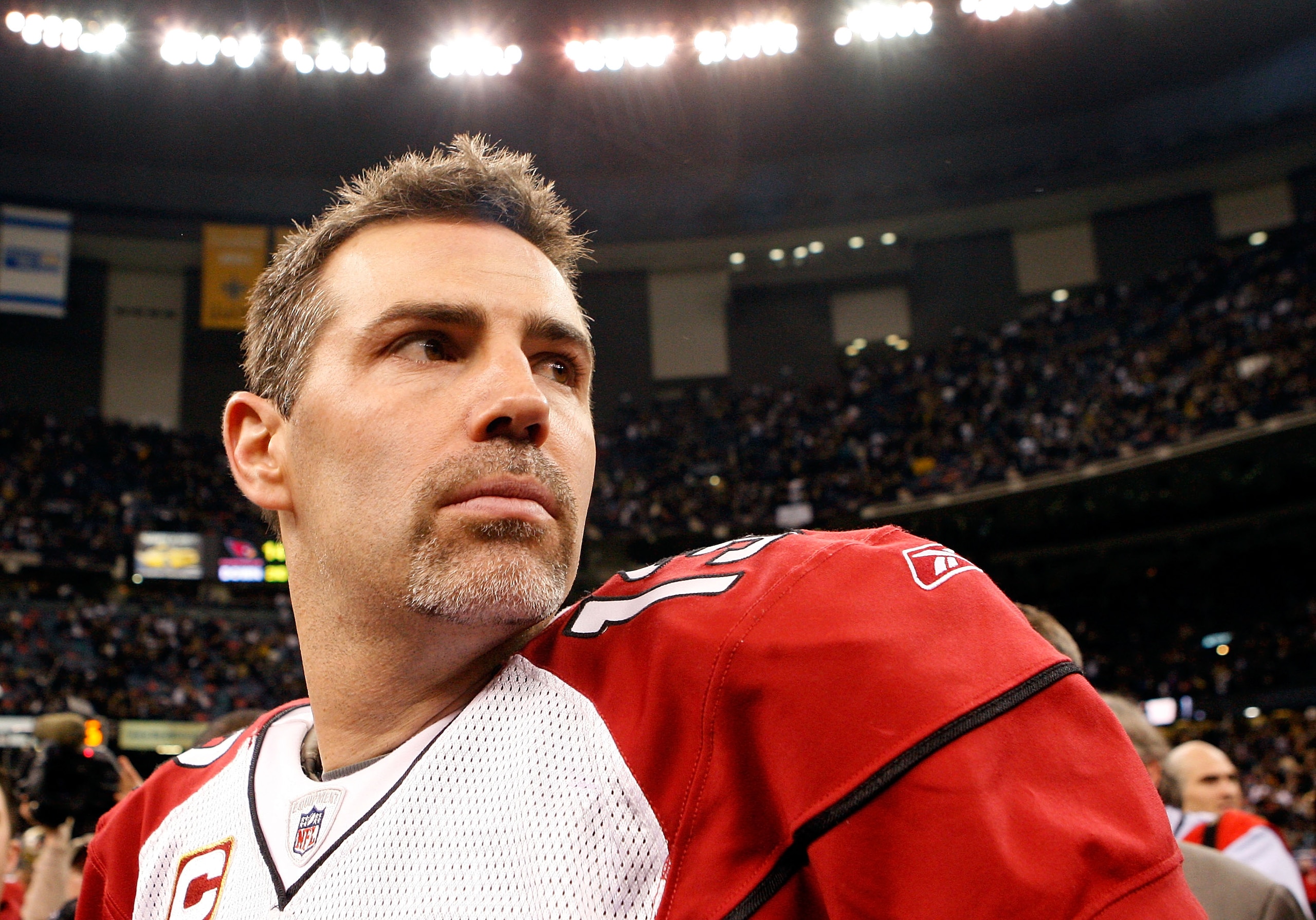 NEW ORLEANS - JANUARY 16:  Quarterback Kurt Warner #13 of the Arizona Cardinals looks on as he stands on the field after their 45-14 loss against the New Orleans Saints during the NFC Divisional Playoff Game at Louisana Superdome on January 16, 2010 in Ne