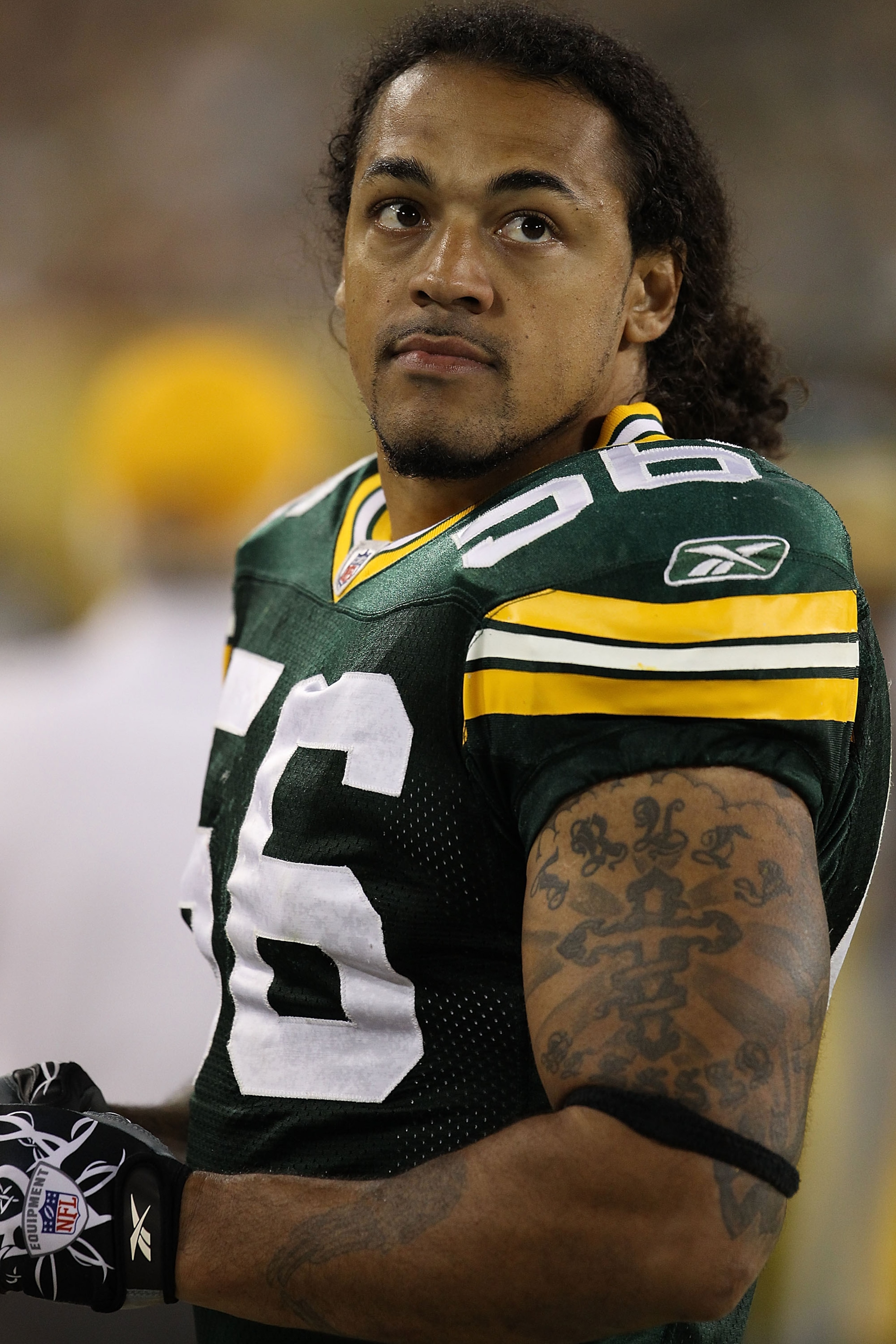 GREEN BAY, WI - AUGUST 26: Nick Barnett #56 of the Green Bay Packers watches from the sidelines as his teammates take on the Indianapolis Colts during a preseason game at Lambeau Field on August 26, 2010 in Green Bay, Wisconsin. The Packers defeated the C