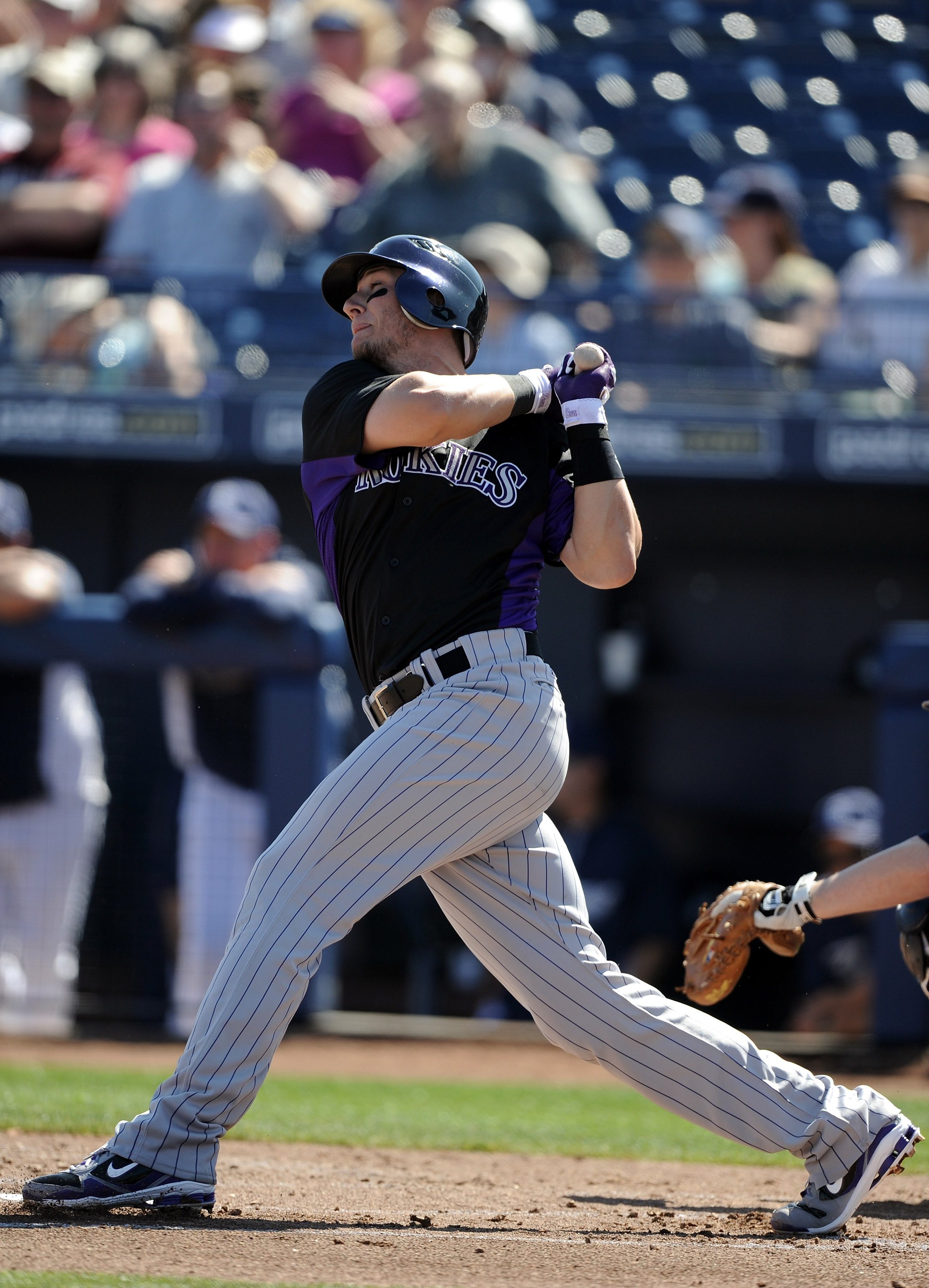 PEORIA, AZ - MARCH 02:  Troy Tulowitzki #2 of the Colorado Rockies at bat against the San Diego Padres during spring training at Peoria Stadium on March 2, 2011 in Peoria, Arizona.  (Photo by Harry How/Getty Images)
