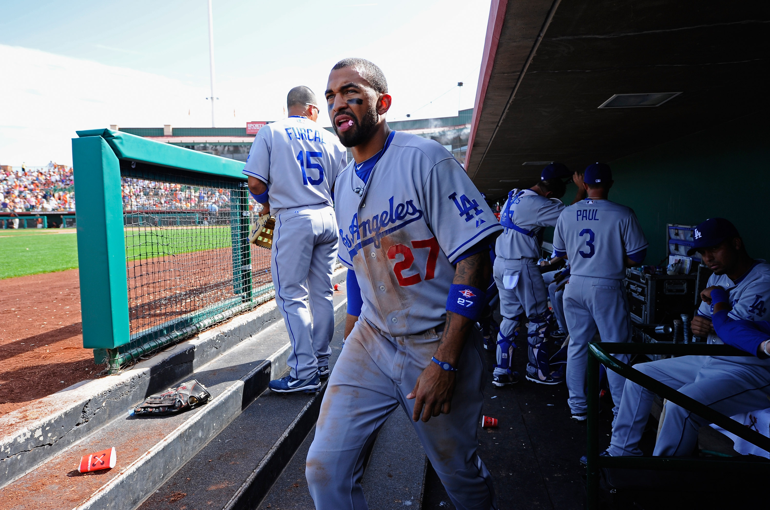 SCOTTSDALE, AZ - MARCH 18:  Matt Kemp #27 of the Los Angeles Dodgers walks out the dugout against the San Francisco Giants during the sixth inning of the baseball game at Scottsdale Stadium on March 18, 2011 in Scottsdale, Arizona.  (Photo by Kevork Djans
