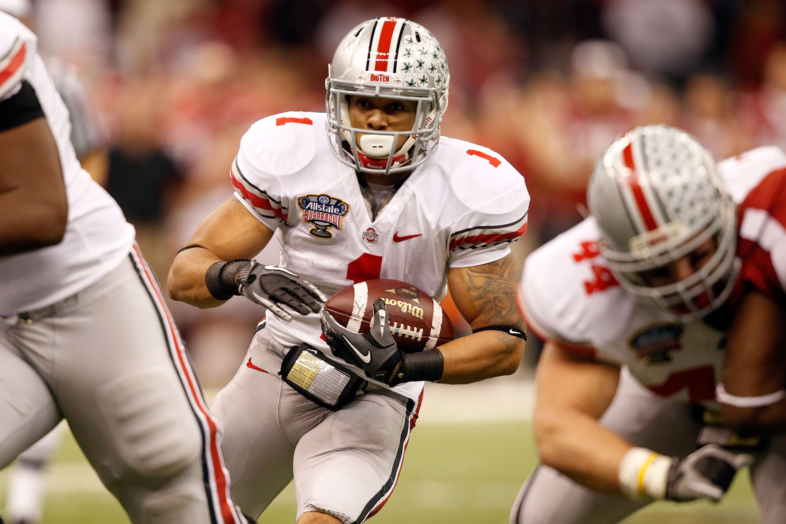 NEW ORLEANS, LA - JANUARY 04:  Dan Herron #1 of the Ohio State Buckeyes runs the ball against the Arkansas Razorbacks during the Allstate Sugar Bowl at the Louisiana Superdome on January 4, 2011 in New Orleans, Louisiana.  (Photo by Matthew Stockman/Getty