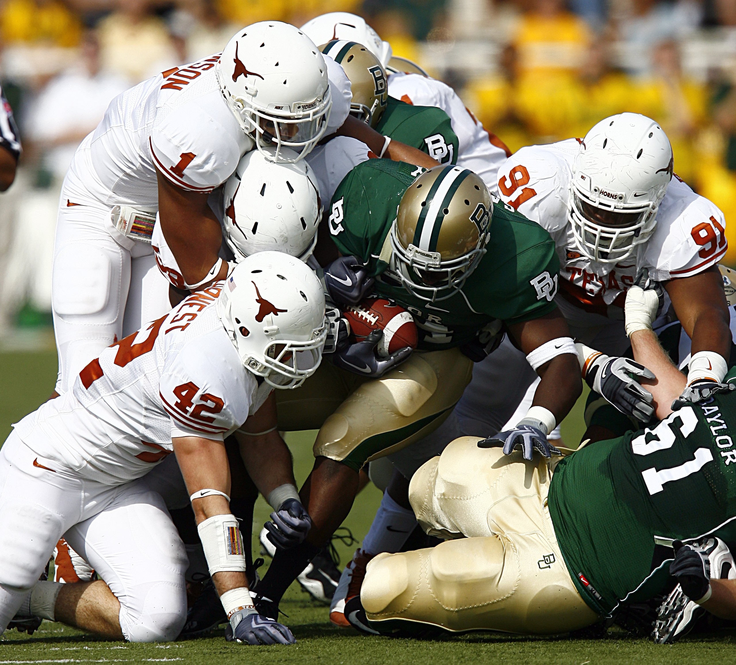 WACO, TX - NOVEMBER 14: Running back Terrance Ganaway #24 of the Baylor Bears carries the ball against linebacker Dusting Earnest #42, linebacker Keenan Robinson #1, and tackle Kheeston Randall #91of the Texas Longhorns during the second half on Novembe WACO, TX - NOVEMBER 14: Running back Terrance Ganaway #24 of the Baylor Bears carries the ball against linebacker Dusting Earnest #42, linebacker Keenan Robinson #1, and tackle Kheeston Randall #91of the Texas Longhorns during the second half on Novembe