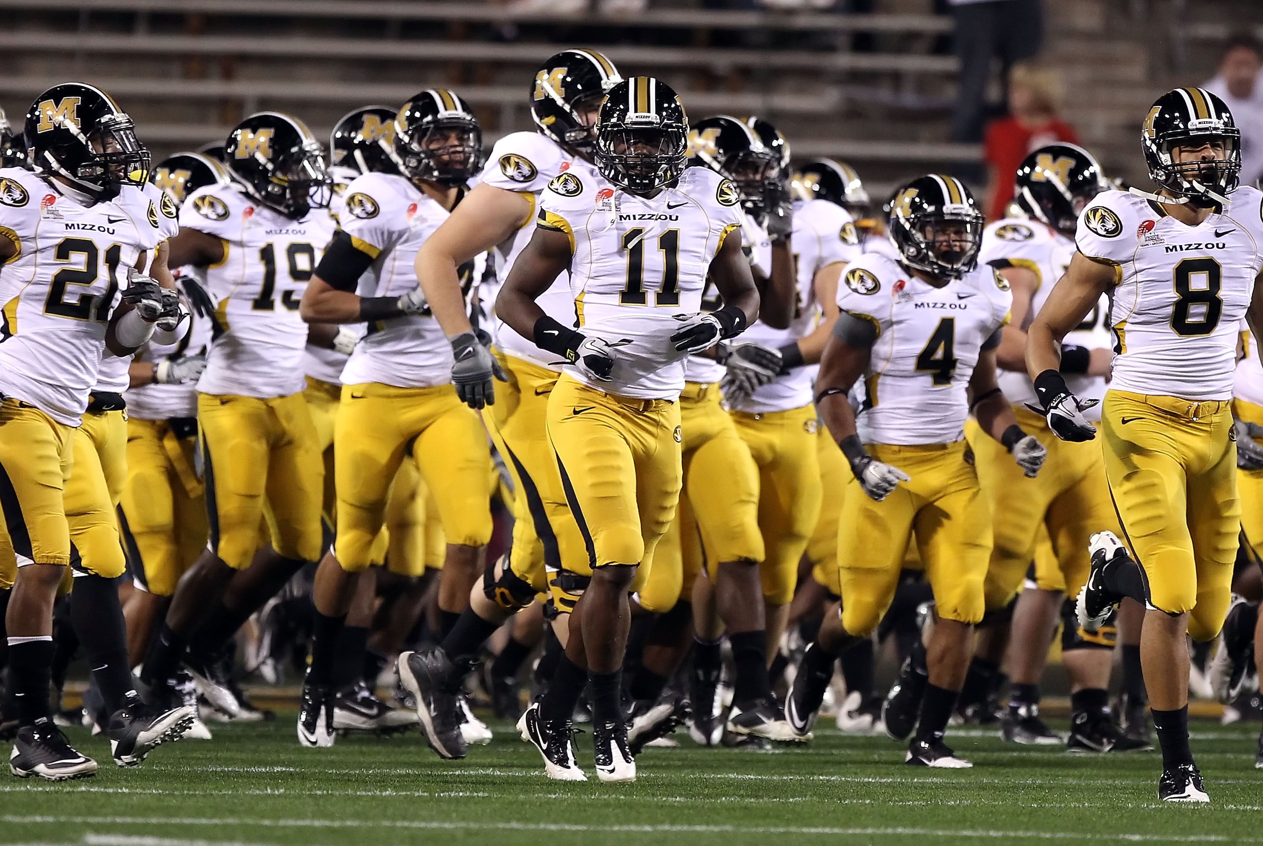 TEMPE, AZ - DECEMBER 28: Jarrell Harrison #11 (C) of the Missouri Tigers runs onto the field with teammates before the Insight Bowl against the Iowa Hawkeyes at Sun Devil Stadium on December 28, 2010 in Tempe, Arizona. (Photo by Christian Petersen/Getty TEMPE, AZ - DECEMBER 28: Jarrell Harrison #11 (C) of the Missouri Tigers runs onto the field with teammates before the Insight Bowl against the Iowa Hawkeyes at Sun Devil Stadium on December 28, 2010 in Tempe, Arizona. (Photo by Christian Petersen/Getty