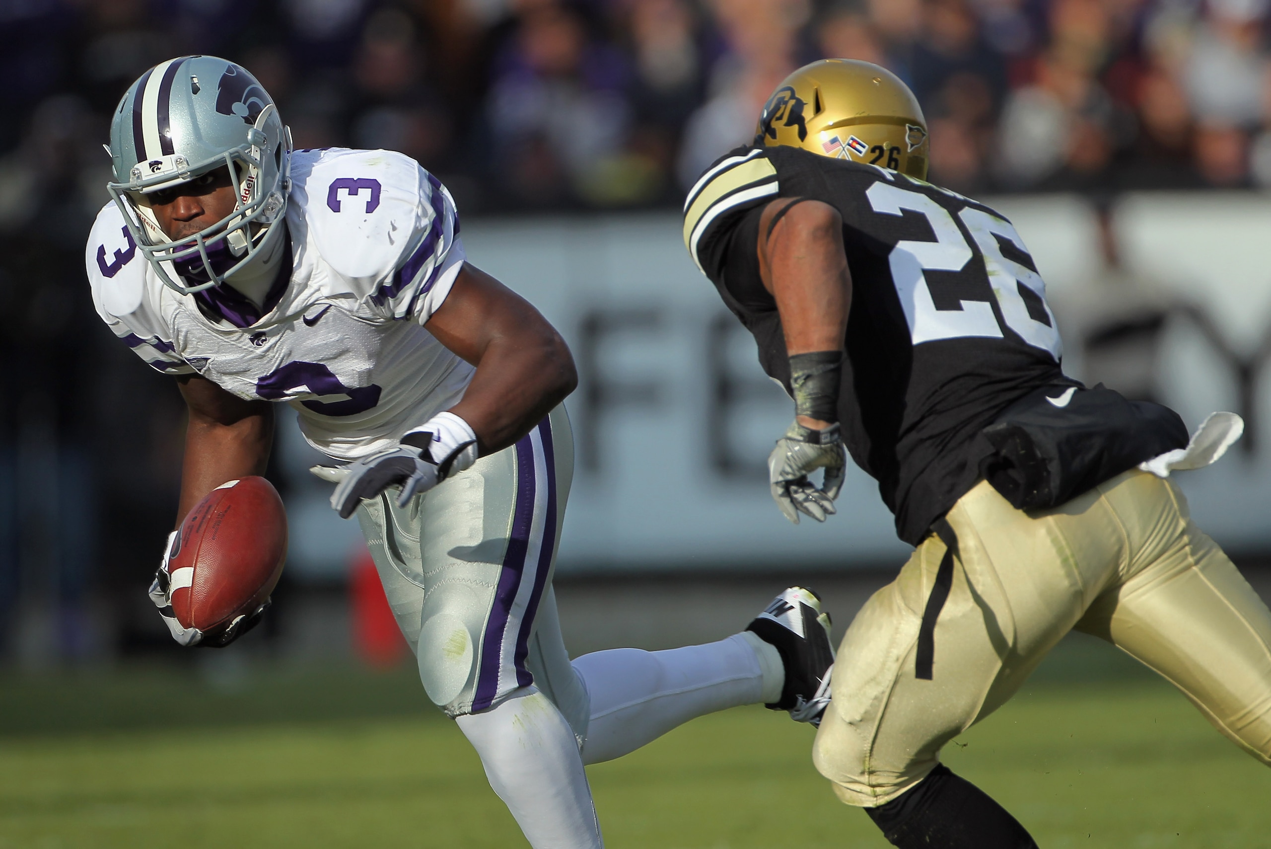 BOULDER, CO - NOVEMBER 20: Wide receiver Chris Harper #3 of the Kansas State Wildcats makes a pass reception as safety Ray Polk #26 of the Colorado Buffaloes defends at Folsom Field on November 20, 2010 in Boulder, Colorado. Colorado defeated Kansas Stat BOULDER, CO - NOVEMBER 20: Wide receiver Chris Harper #3 of the Kansas State Wildcats makes a pass reception as safety Ray Polk #26 of the Colorado Buffaloes defends at Folsom Field on November 20, 2010 in Boulder, Colorado. Colorado defeated Kansas Stat