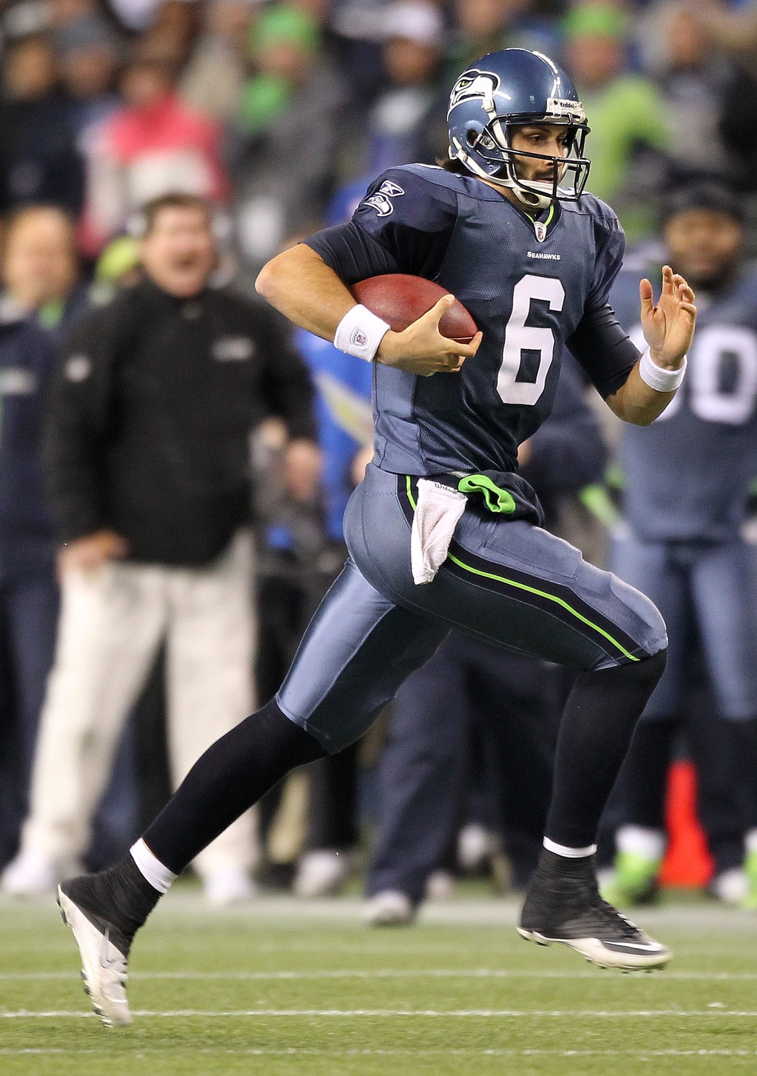 SEATTLE, WA - JANUARY 02:  Quarterback Charlie Whitehurst #6 of the Seattle Seahawks runs with the ball during their game against the St. Louis Rams at Qwest Field on January 2, 2011 in Seattle, Washington.  (Photo by Otto Greule Jr/Getty Images)