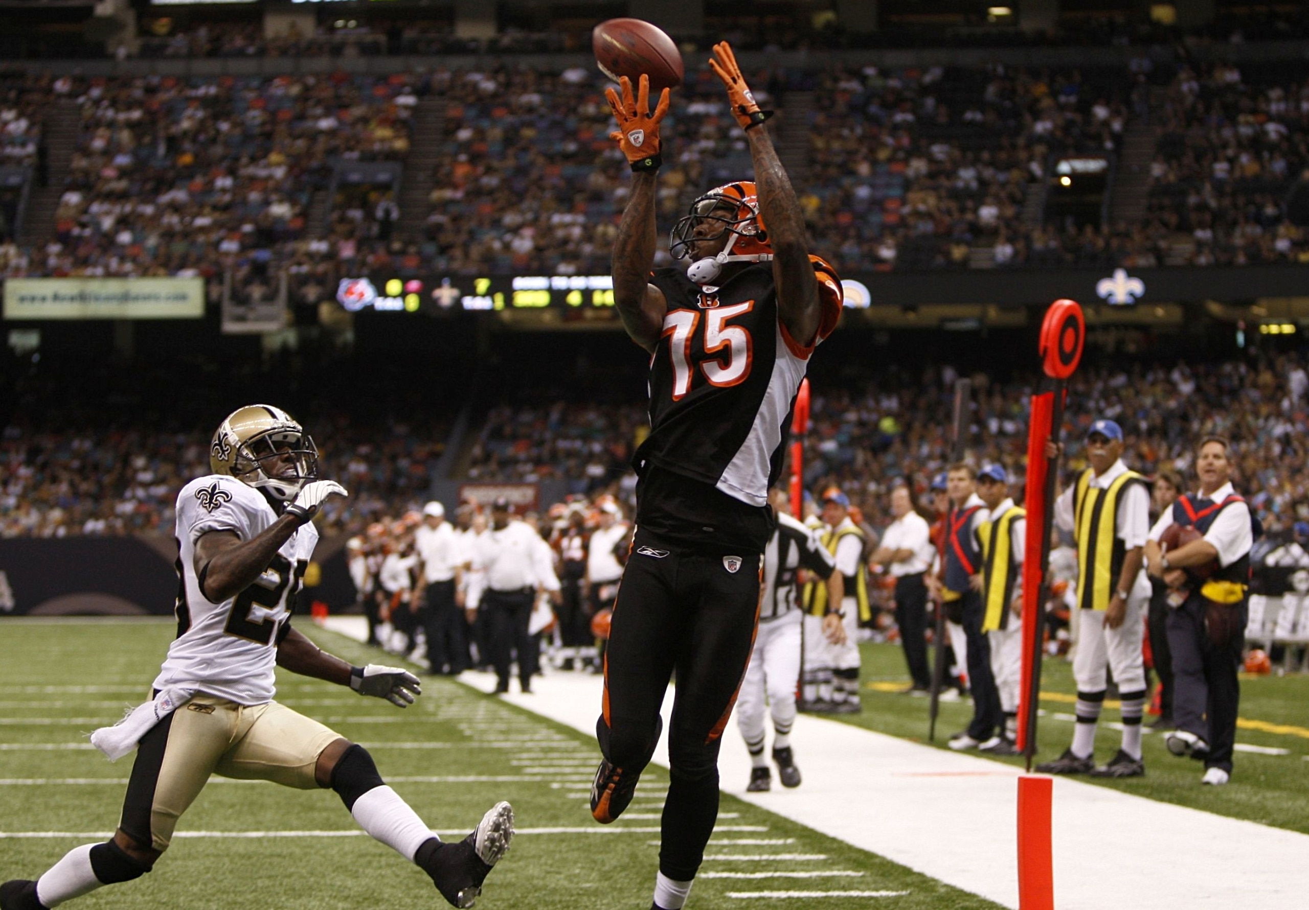 NEW ORLEANS - AUGUST 14: Wide receiver Chris Henry #15 of the Cincinnati Bengals catches the ball in the end zone for a touchdown against Jason David #29 of the New Orleans Saints during the preseason game on August 14, 2009 at the Superdome in New Orlea NEW ORLEANS - AUGUST 14: Wide receiver Chris Henry #15 of the Cincinnati Bengals catches the ball in the end zone for a touchdown against Jason David #29 of the New Orleans Saints during the preseason game on August 14, 2009 at the Superdome in New Orlea