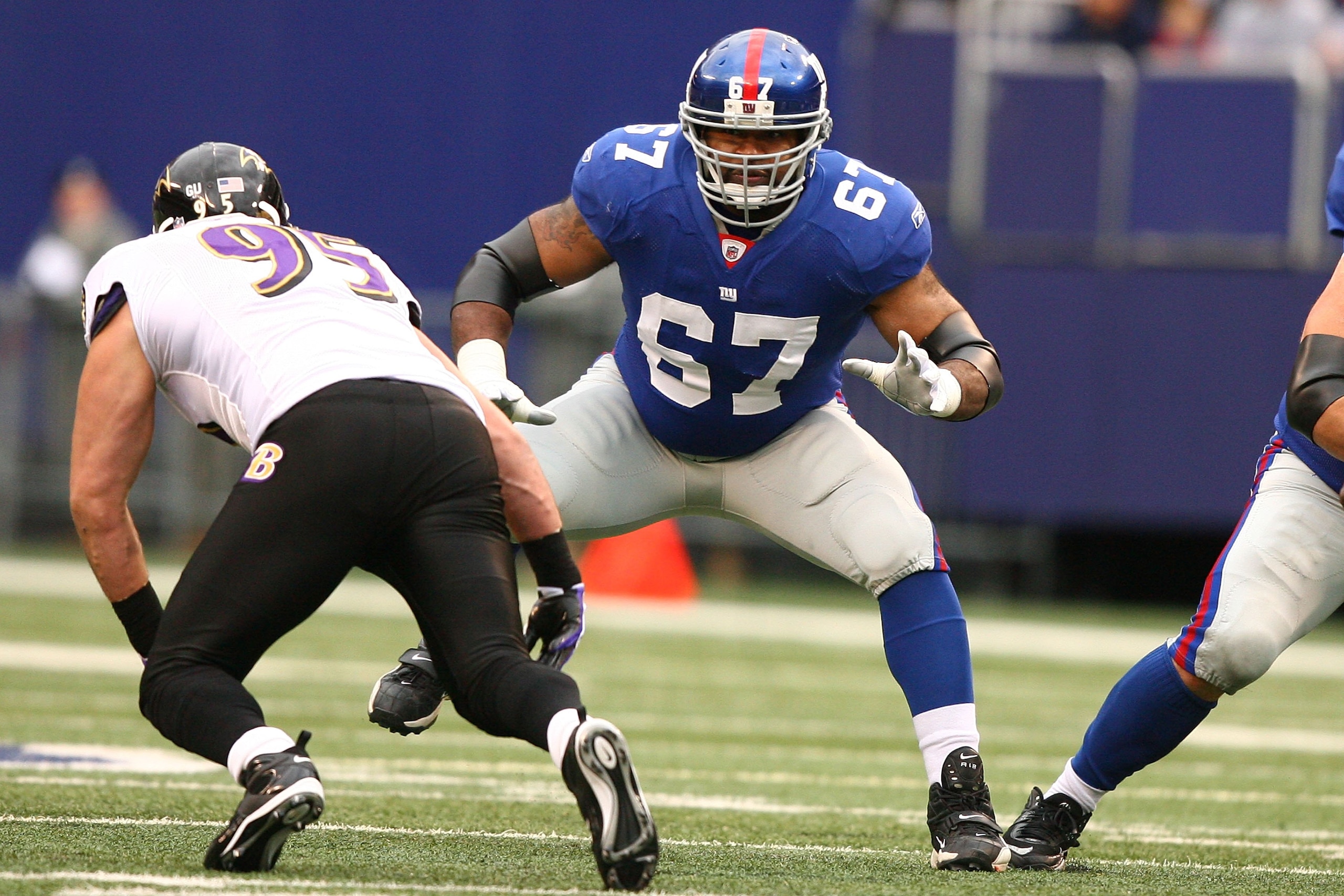 EAST RUTHERFORD, NJ - NOVEMBER 16:  Kareem McKenzie #67 of the New York Giants pass blocks against Jarret Johnson #95 of the Baltimore Ravens during their game on November 16, 2008 at Giants Stadium in East Rutherford, New Jersey.  (Photo by Al Bello/Gett