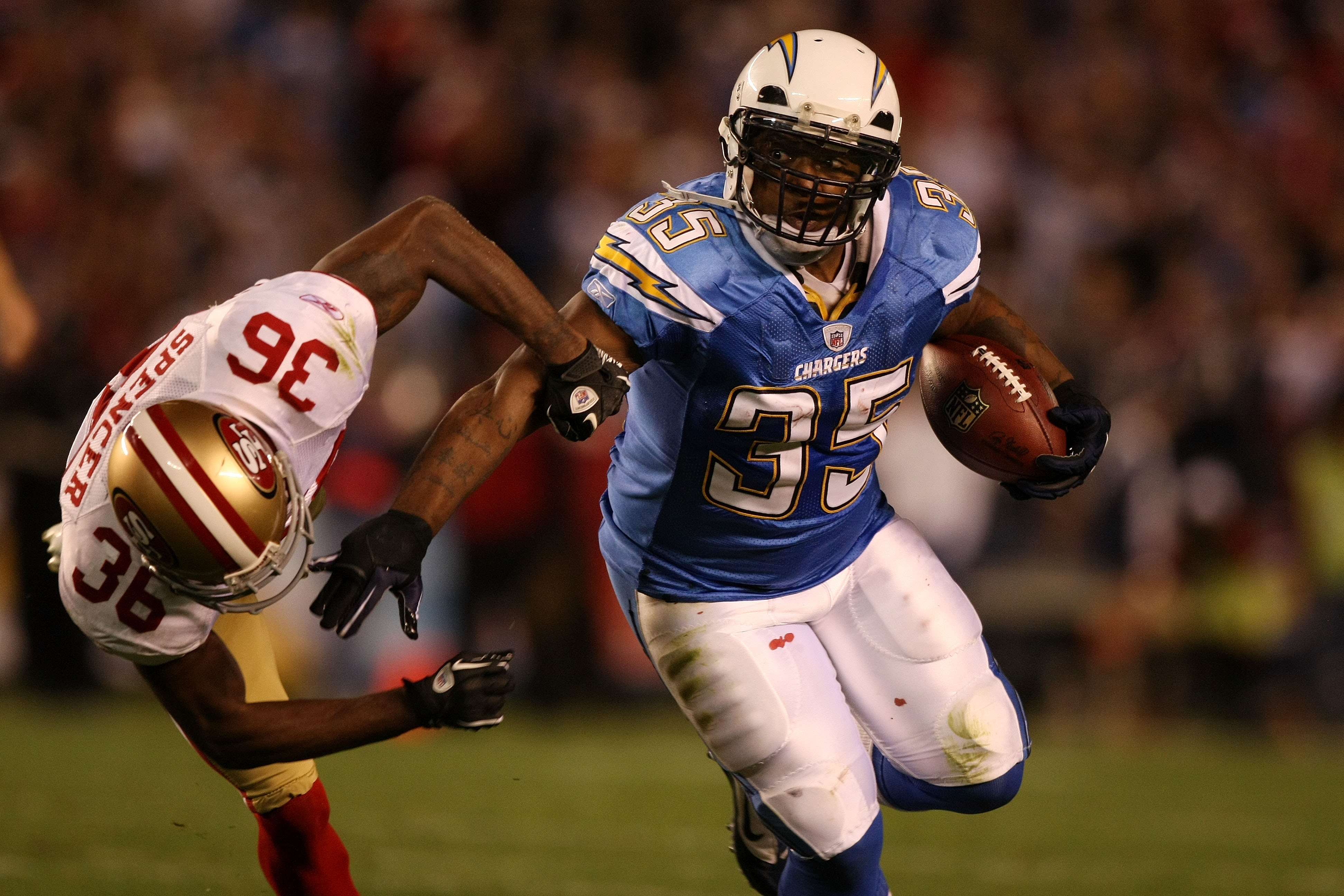 SAN DIEGO, CA - DECEMBER 16: Running back Mike Tolbert #35 of the San Diego Chargers rushes with the ball as cornerback Shawntae Spencer #36 of the San Francisco 49ers trys to tackle him at Qualcomm Stadium on December 16, 2010 in San Diego, California. SAN DIEGO, CA - DECEMBER 16: Running back Mike Tolbert #35 of the San Diego Chargers rushes with the ball as cornerback Shawntae Spencer #36 of the San Francisco 49ers trys to tackle him at Qualcomm Stadium on December 16, 2010 in San Diego, California.