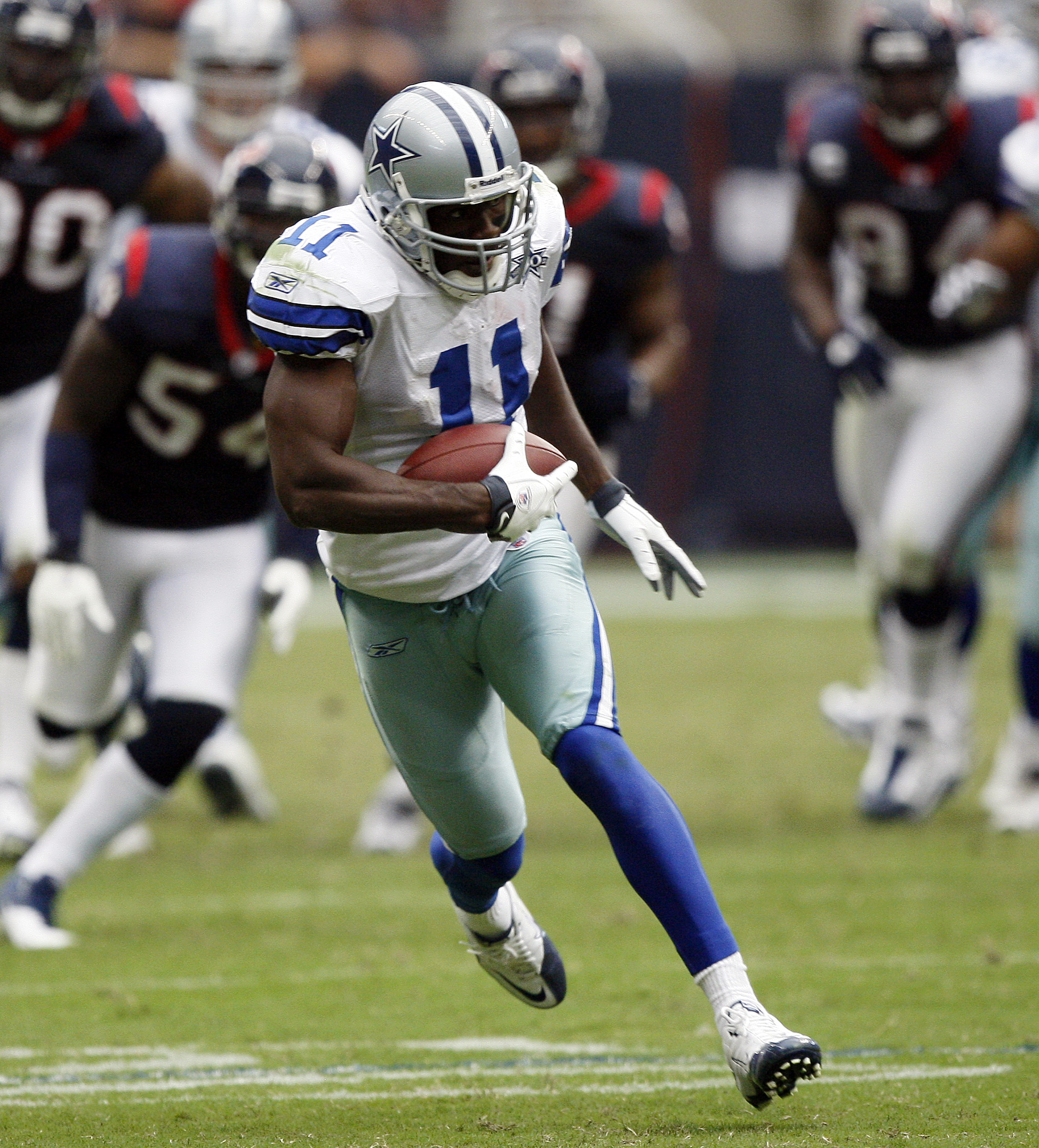 HOUSTON - SEPTEMBER 26: Wide receiver Roy Williams #11 of the Dallas Cowboys runs for a 63 yard touchdown in the fourth quarter against the Houston Texans at Reliant Stadium on September 26, 2010 in Houston, Texas. (Photo by Bob Levey/Getty Images) HOUSTON - SEPTEMBER 26: Wide receiver Roy Williams #11 of the Dallas Cowboys runs for a 63 yard touchdown in the fourth quarter against the Houston Texans at Reliant Stadium on September 26, 2010 in Houston, Texas. (Photo by Bob Levey/Getty Images)