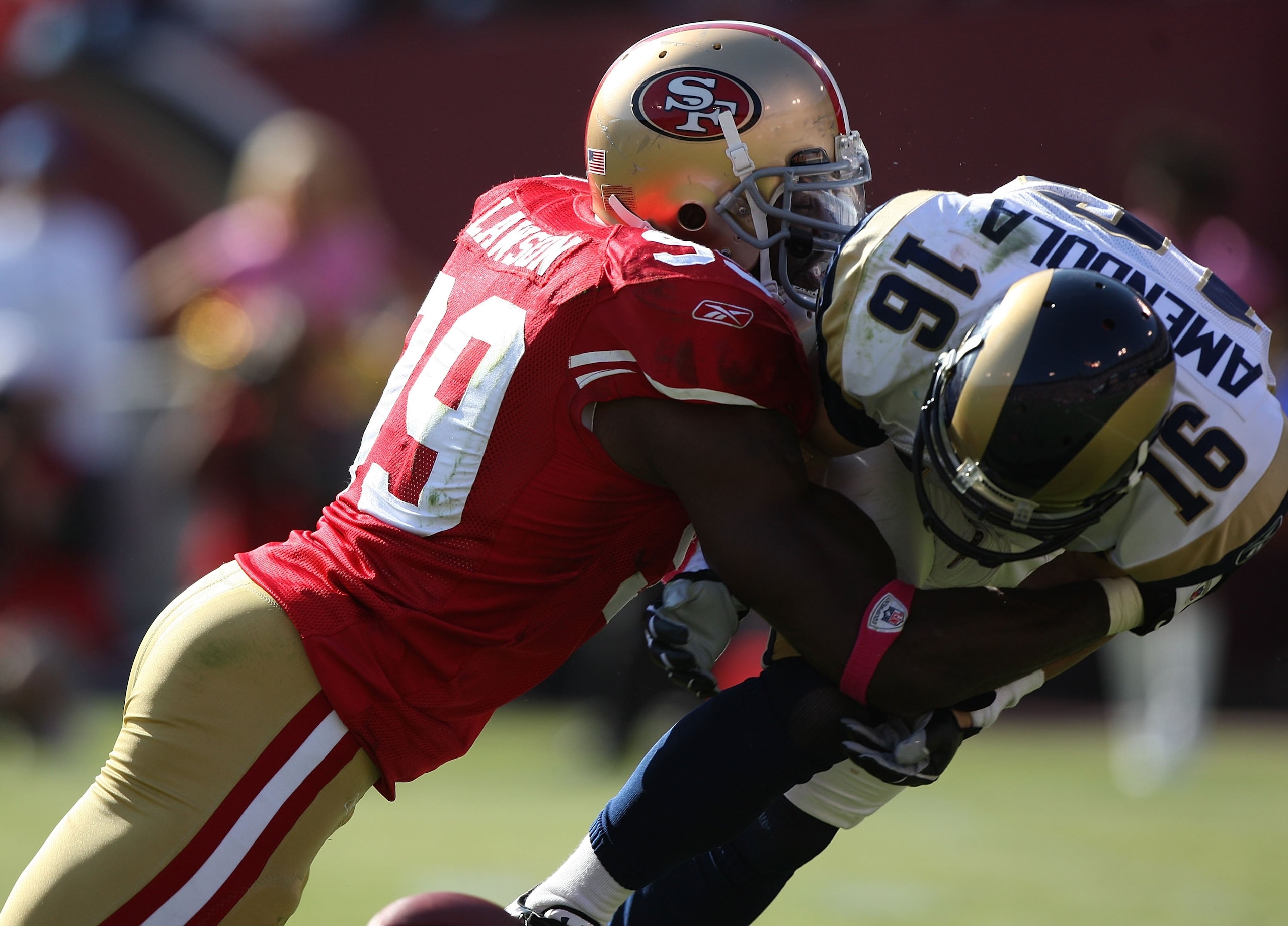 SAN FRANCISCO - OCTOBER 04:  Manny Lawson #99 of the San Francisco 49ers in action against the St. Louis Rams during an NFL game on October 4, 2009 at Candlestick Park in San Francisco, California.  (Photo by Jed Jacobsohn/Getty Images)