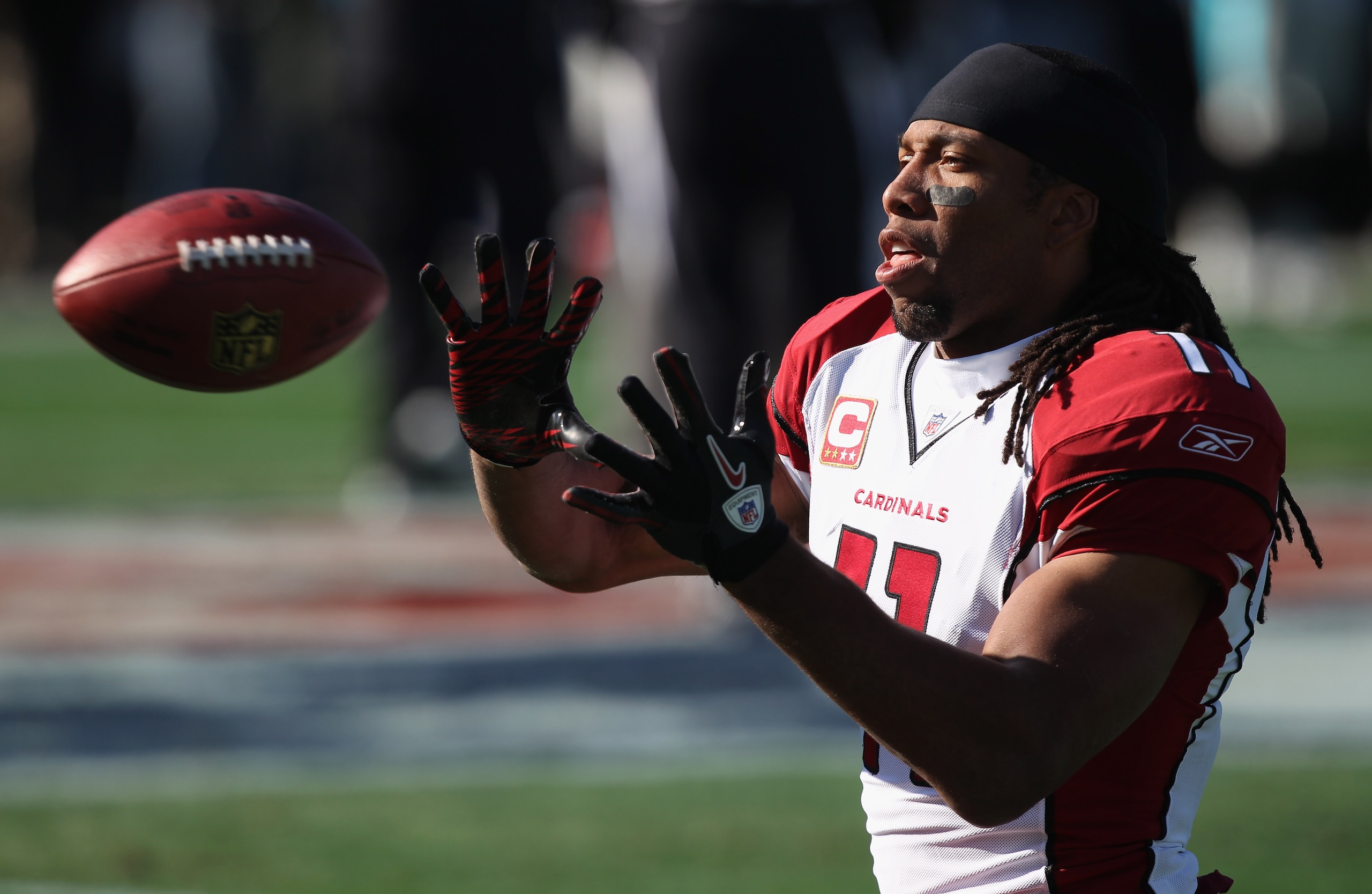 CHARLOTTE, NC - DECEMBER 19:  Larry Fitzgerald #11 of the Arizona Cardinals warms up before the start of their game against the Carolina Panthers at Bank of America Stadium on December 19, 2010 in Charlotte, North Carolina.  (Photo by Streeter Lecka/Getty