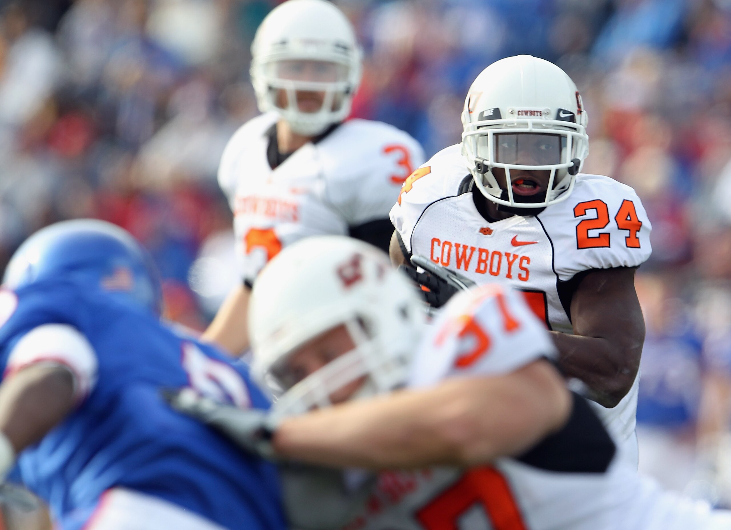 LAWRENCE, KS - NOVEMBER 20:  Running back Kendall Hunter #24 of the Oklahoma State Cowboys carries the ball during the game against the Kansas Jayhawks on November 20, 2010 at Memorial Stadium in Lawrence, Kansas.  (Photo by Jamie Squire/Getty Images)