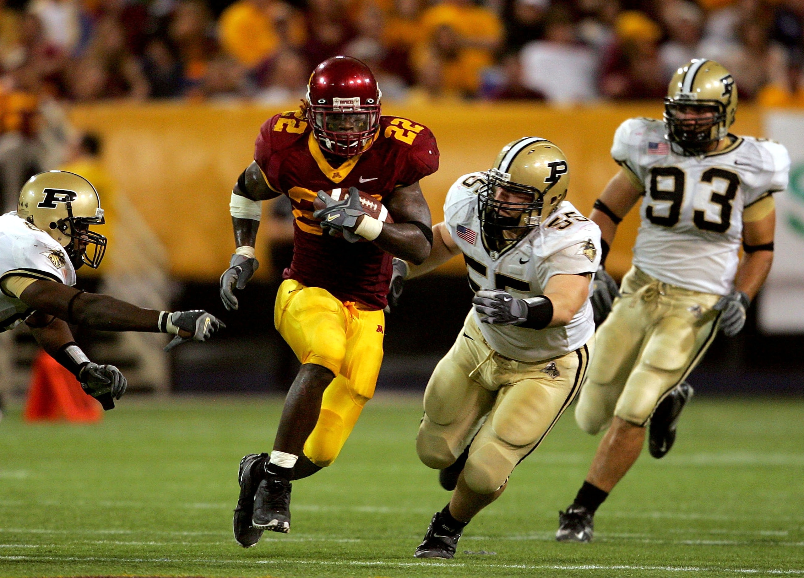 MINNEAPOLIS, MN - SEPTEMBER 24: Laurence Maroney #22 of Minnesota carries the ball against Cliff Avril #85, Brandon Villareal #55 and Rob Ninkovich #93 of Purdue in the third quarter on September 24, 2005 at the Hubert H. Humphrey Metrodome in Minneapolis