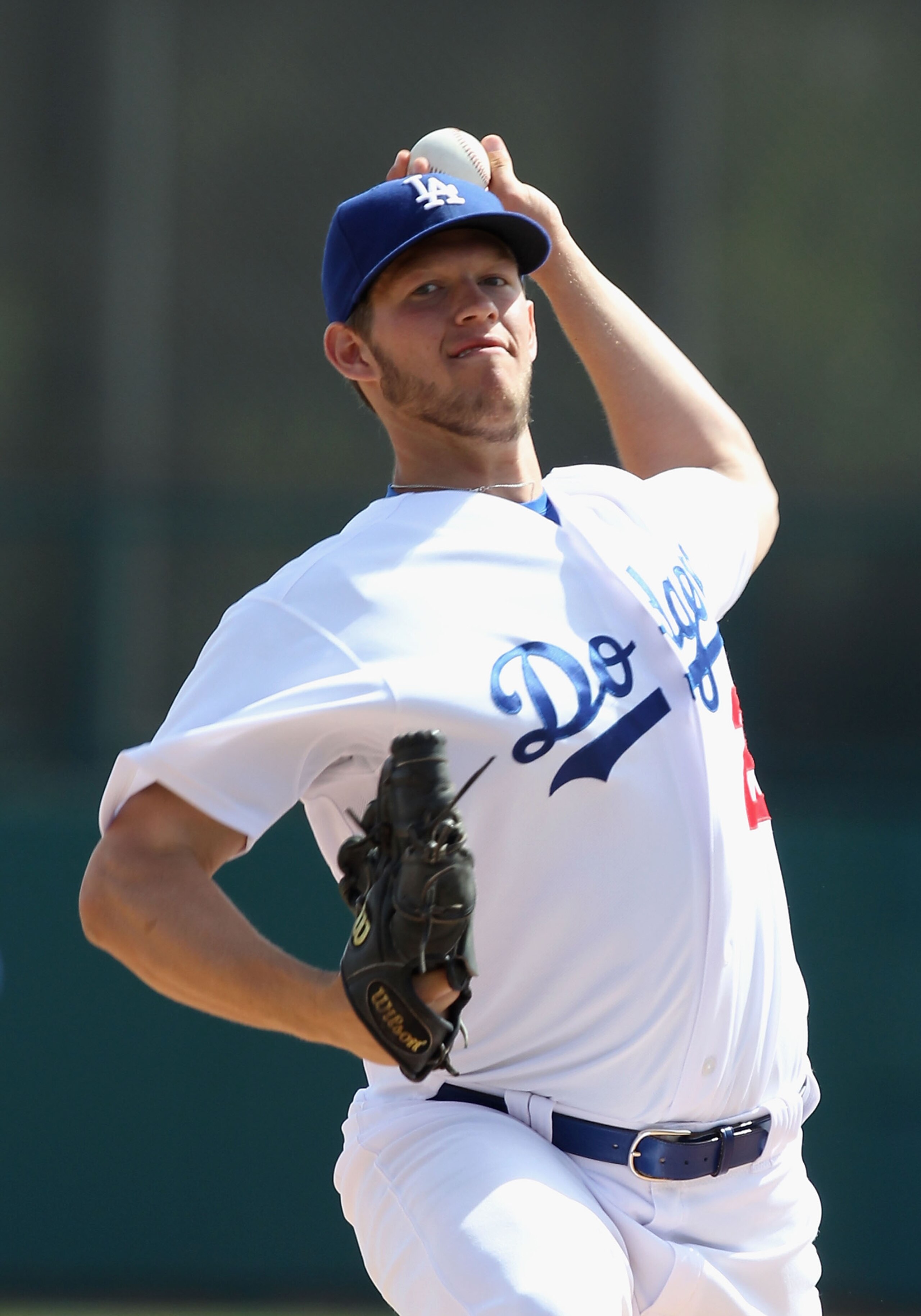 GLENDALE, AZ - MARCH 05:  Starting pitcher Clayton Kershaw #22 of the Los Angeles Dodgers pitches against the Cincinnati Reds during the spring training game at Camelback Ranch on March 5, 2011 in Glendale, Arizona.  (Photo by Christian Petersen/Getty Ima