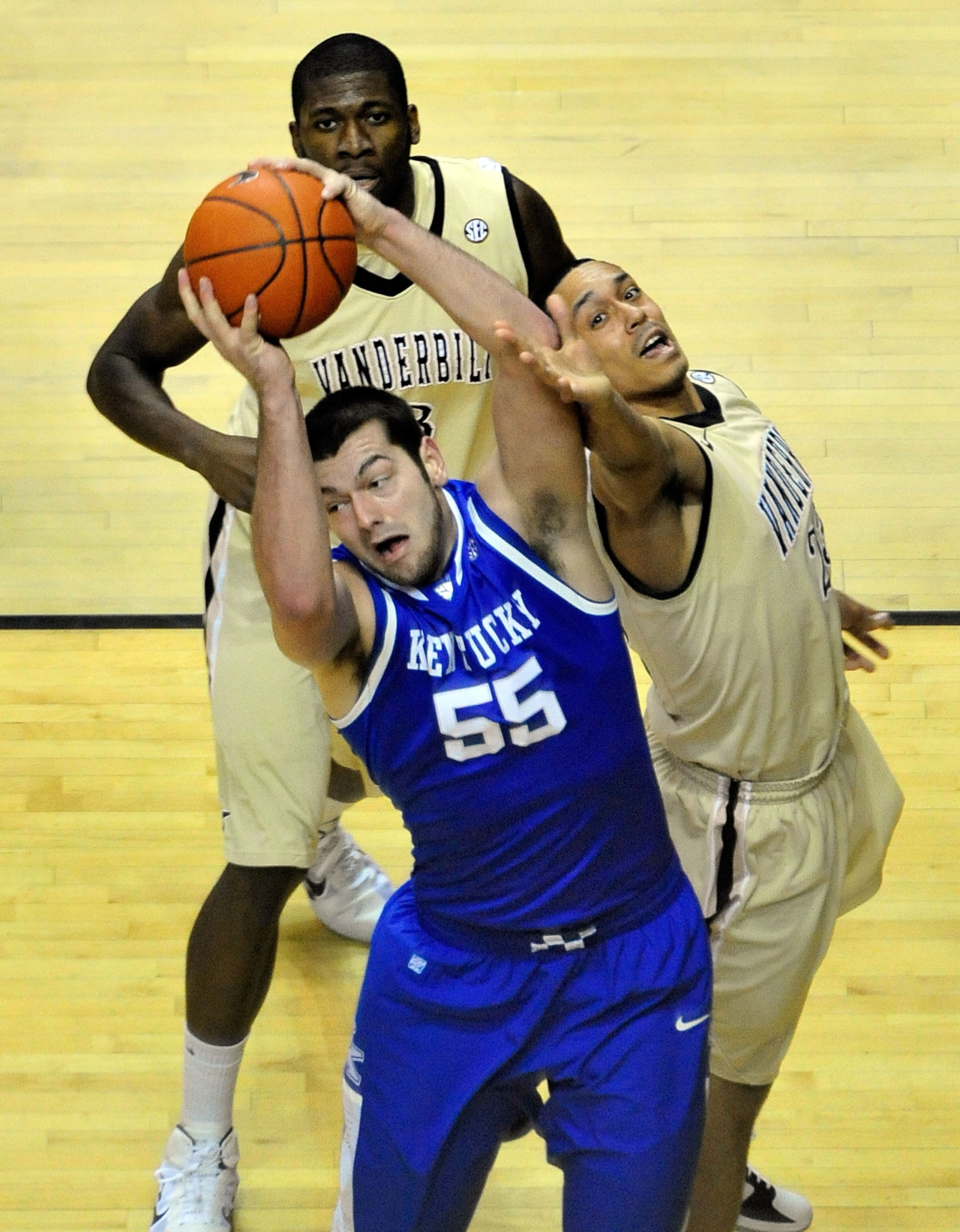 NASHVILLE, TN - FEBRUARY 12:  Josh Harrelson #55 of the Kentucky Wildcats takes a rebound away from John Jenkins #23 of the Vanderbilt Commodores at Memorial Gym on February 12, 2011 in Nashville, Tennessee.  (Photo by Grant Halverson/Getty Images)