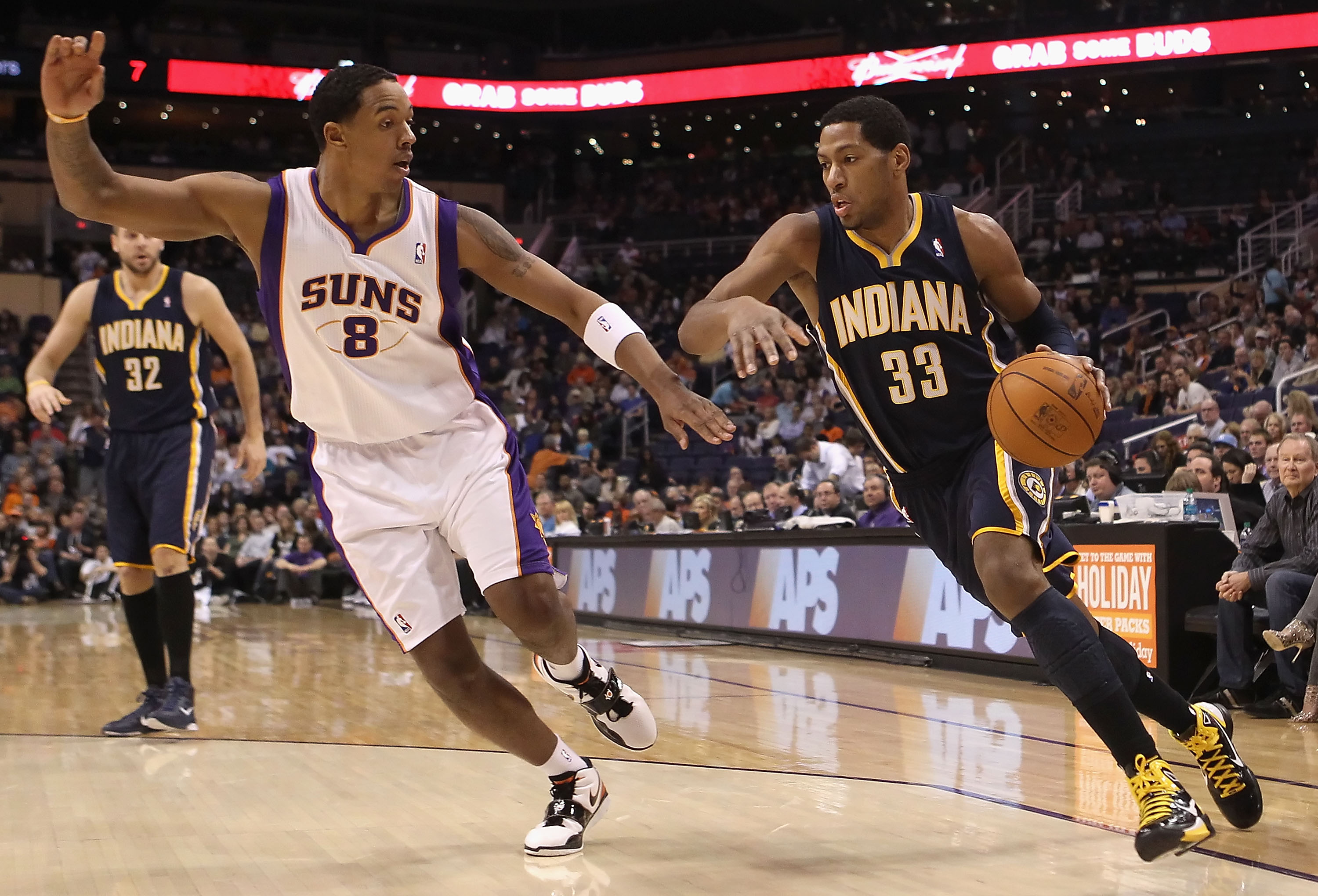PHOENIX - DECEMBER 03:  Danny Granger #33 of the Indiana Pacers drives the ball against Channing Frye #8 of the Phoenix Suns during the NBA game at US Airways Center on December 3, 2010 in Phoenix, Arizona. NOTE TO USER: User expressly acknowledges and ag