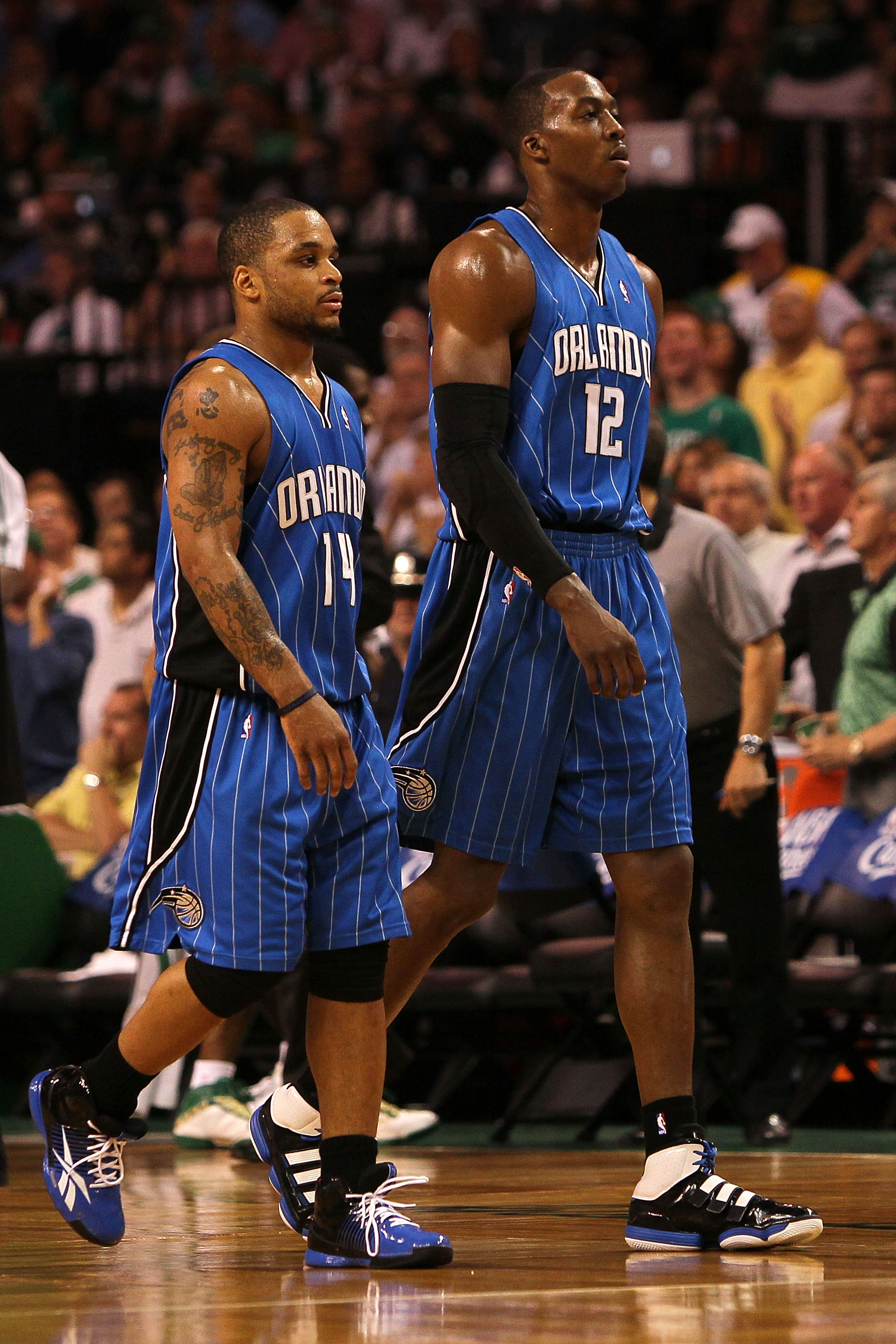 BOSTON - MAY 24:  (L-R) Jameer Nelson #14 and Dwight Howard #12 of the Orlando Magic walk towards the bench against the Boston Celtics in Game Four of the Eastern Conference Finals during the 2010 NBA Playoffs at TD Banknorth Garden on May 24, 2010 in Bos