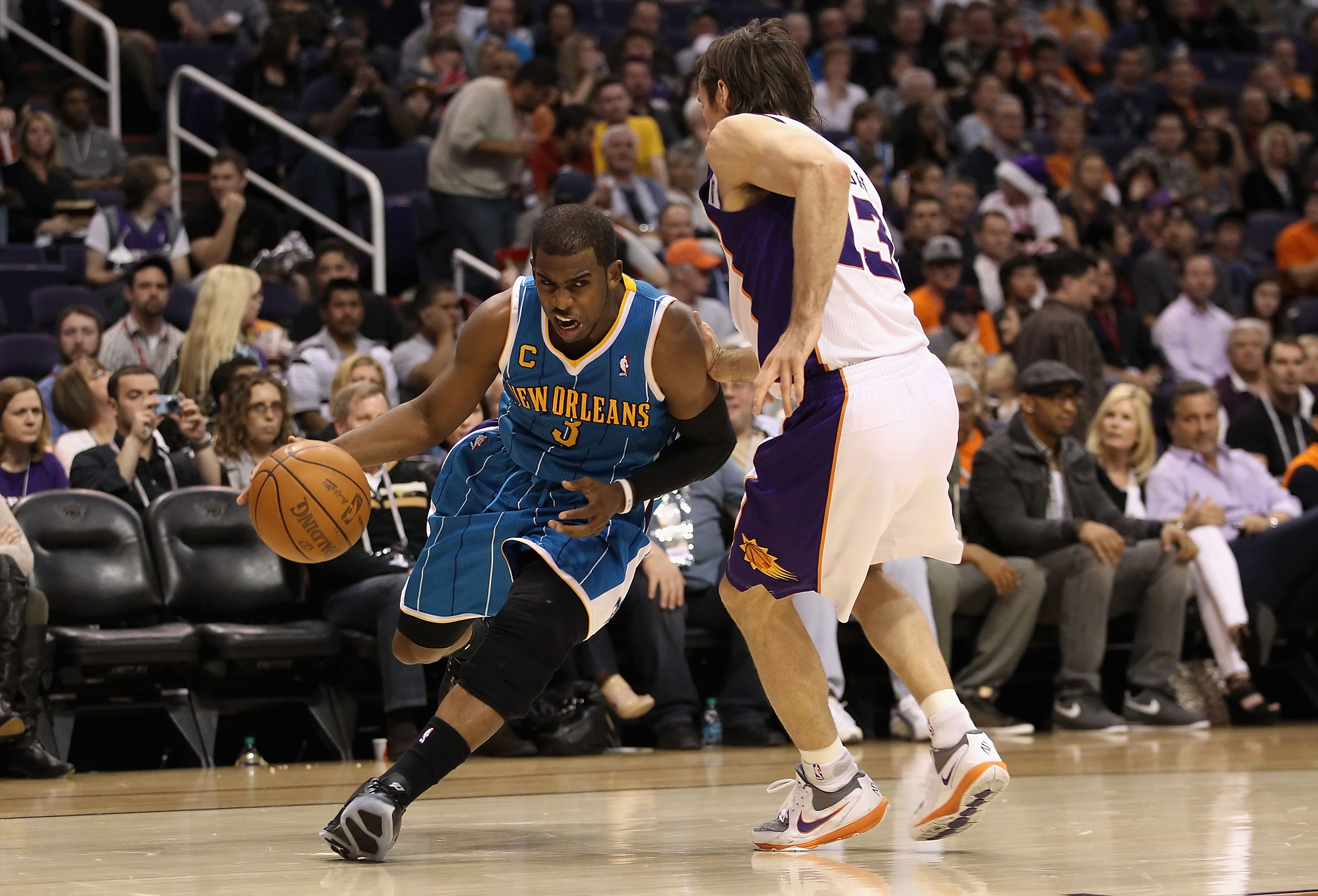 PHOENIX, AZ - JANUARY 30:  Chris Paul #3 of the New Orleans Hornets handles the ball during the NBA game against  the Phoenix Suns at US Airways Center on January 30, 2011 in Phoenix, Arizona.  The Suns defeated the Hornets 104-102. NOTE TO USER: User exp