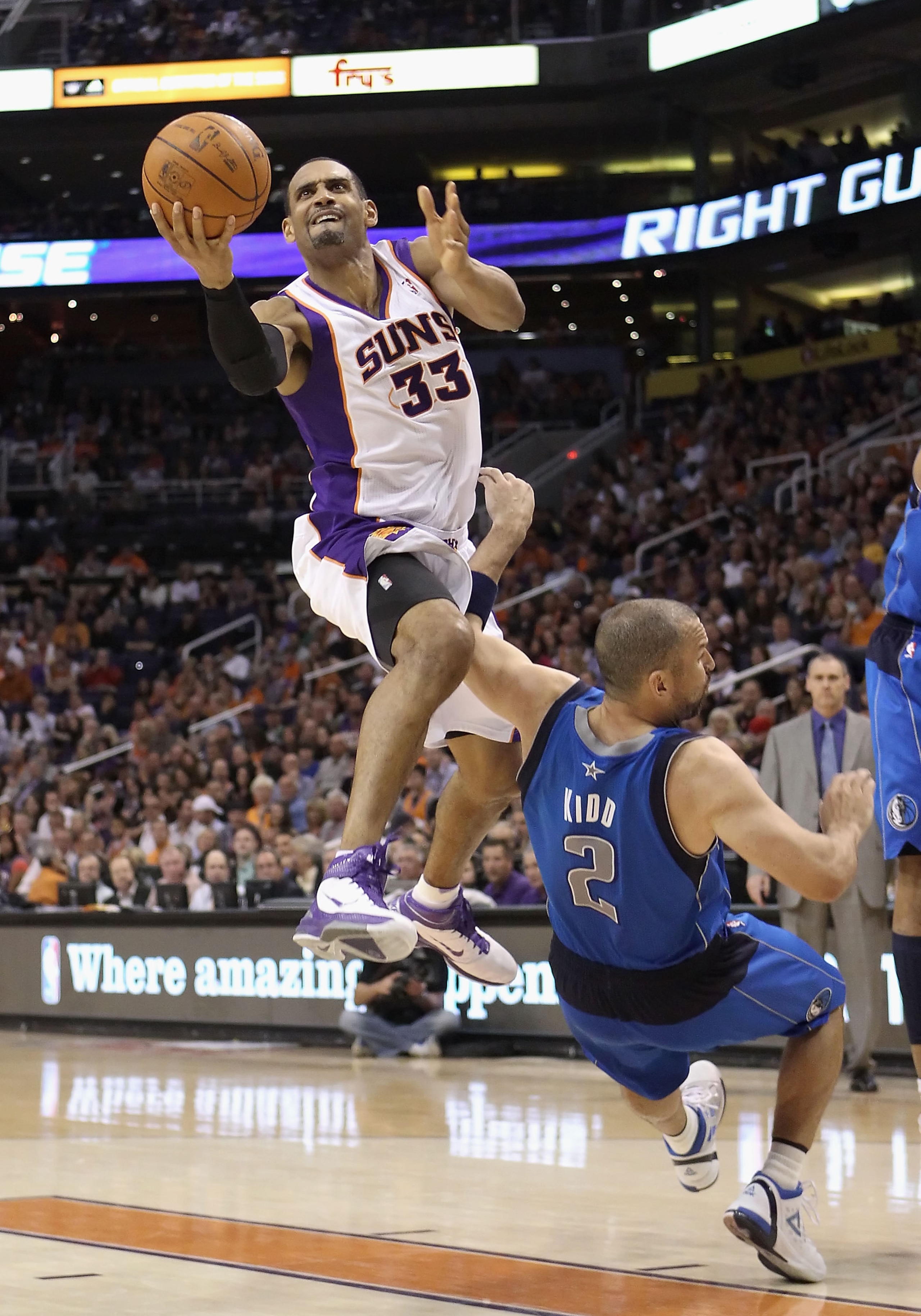 PHOENIX, AZ - MARCH 27:  Grant Hill  #33 of the Phoenix Suns attempts a shot over Jason Kidd #2 of the Dallas Mavericks during the NBA game at US Airways Center on March 27, 2011 in Phoenix, Arizona.  The Mavericks defeated the Suns 91-83.  NOTE TO USER: