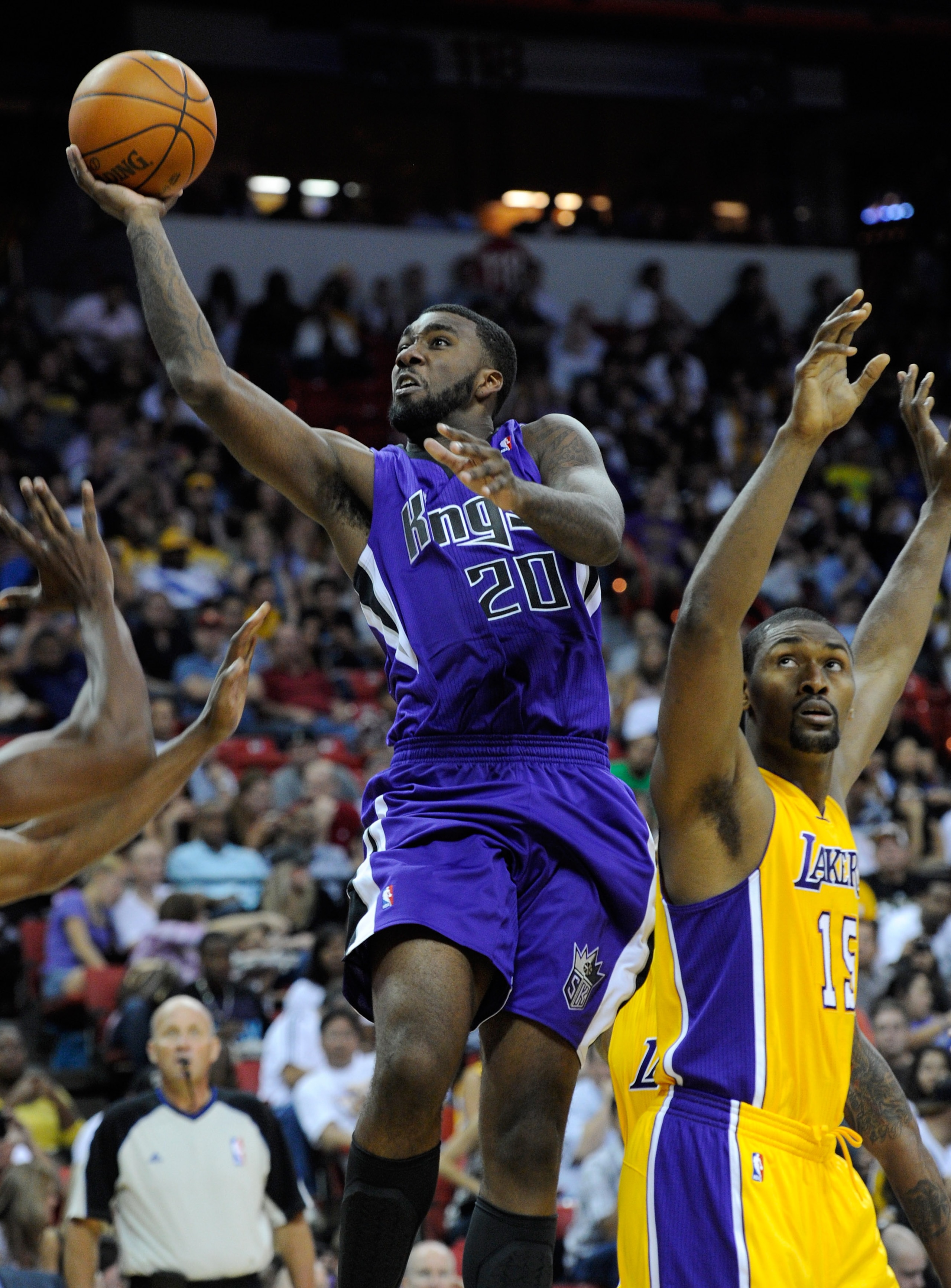 LAS VEGAS - OCTOBER 13: Donte Greene #20 of the Sacramento Kings drives past Ron Artest #15 of the Los Angeles Lakers during their preseason game at the Thomas & Mack Center October 13, 2010 in Las Vegas, Nevada. The Lakers won 98-95. NOTE TO USER: User LAS VEGAS - OCTOBER 13: Donte Greene #20 of the Sacramento Kings drives past Ron Artest #15 of the Los Angeles Lakers during their preseason game at the Thomas & Mack Center October 13, 2010 in Las Vegas, Nevada. The Lakers won 98-95. NOTE TO USER: User