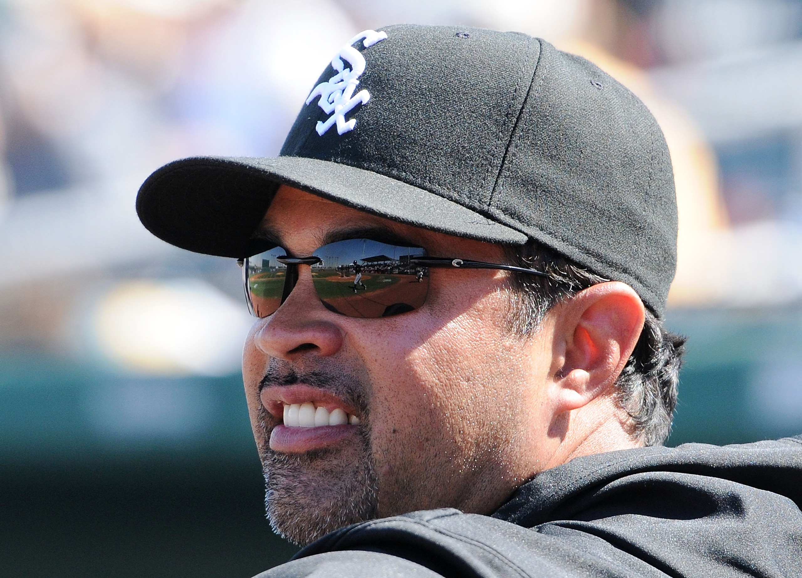 GOODYEAR, AZ - MARCH 02: Manager Ozzie Guillen #13 of the Chicago White Sox watches warm ups prior to a game against the Cincinnati Reds at Goodyear Ballpark on March 2, 2011 in Goodyear, Arizona.  (Photo by Norm Hall/Getty Images)