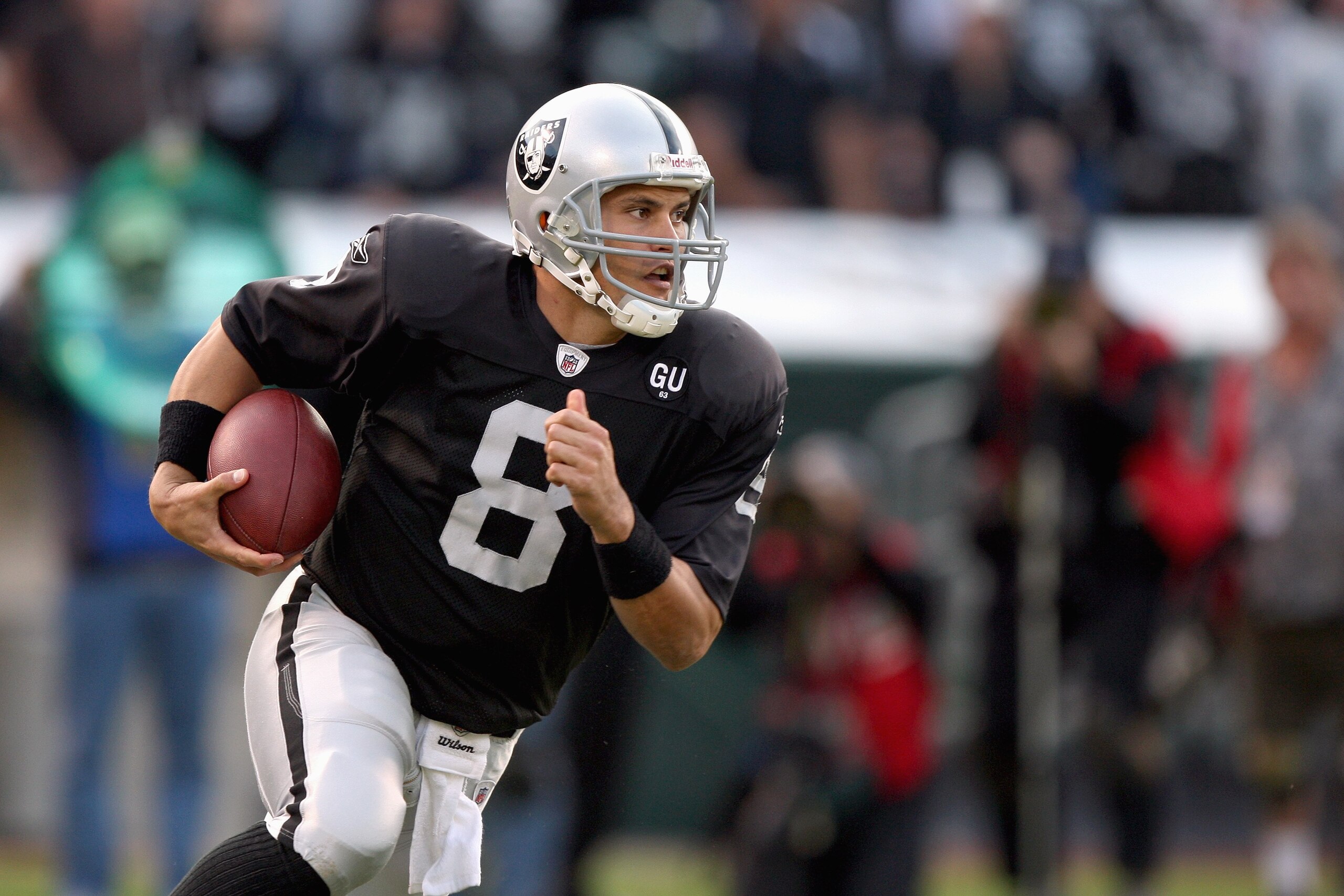 OAKLAND, CA - NOVEMBER 9:  Quarterback Marques Tuiasosopo #8 of the Oakland Raiders runs the ball during the game against the Carolina Panthers at the Oakland-Alameda County Coliseum on November 9, 2008 in Oakland, California. (Photo by Jed Jacobsohn/Gett