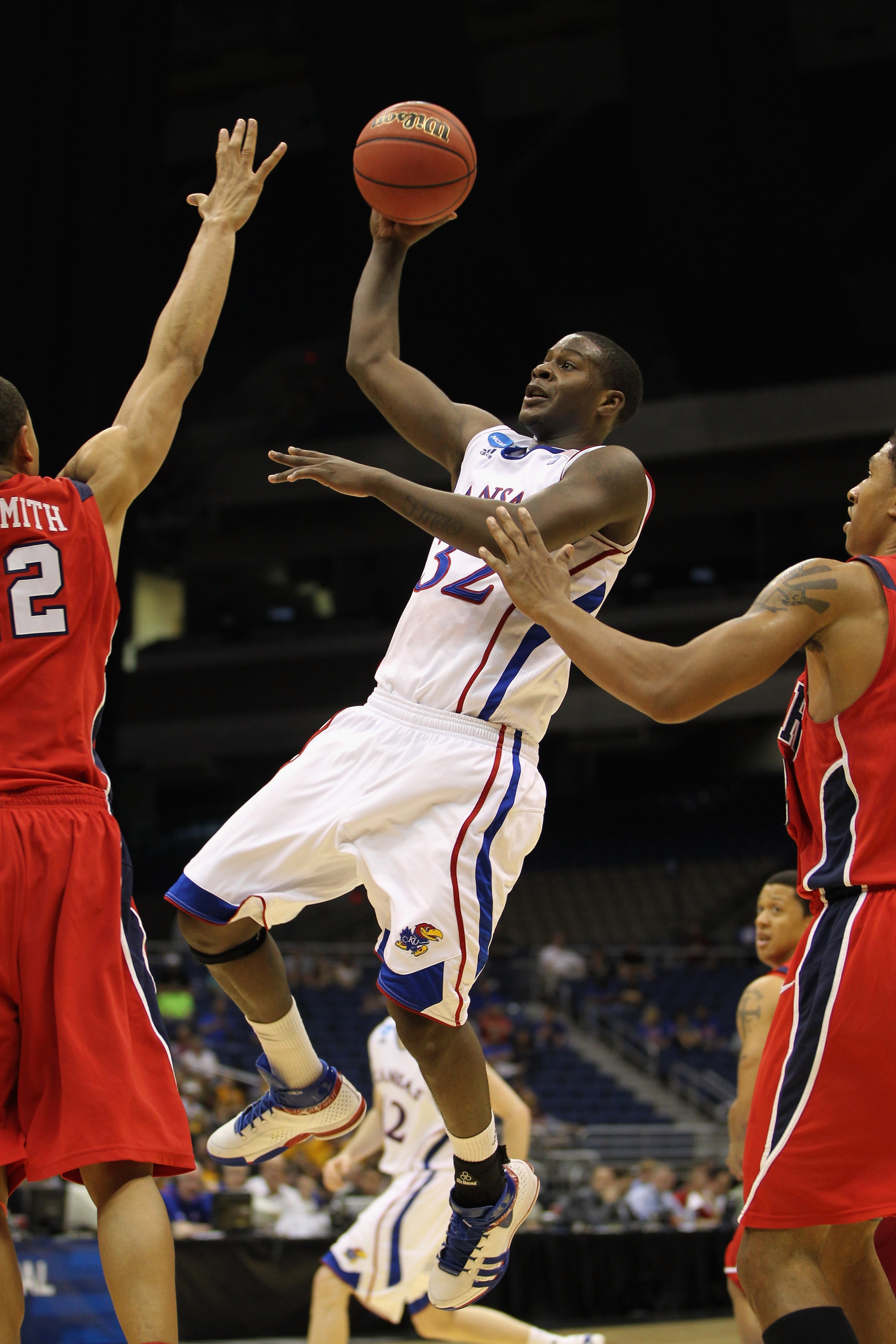SAN ANTONIO, TX - MARCH 25:  Josh Selby #32 of the Kansas Jayhawks puts up a shot against the Richmond Spiders during the southwest regional of the 2011 NCAA men's basketball tournament at the Alamodome on March 25, 2011 in San Antonio, Texas.  (Photo by 
