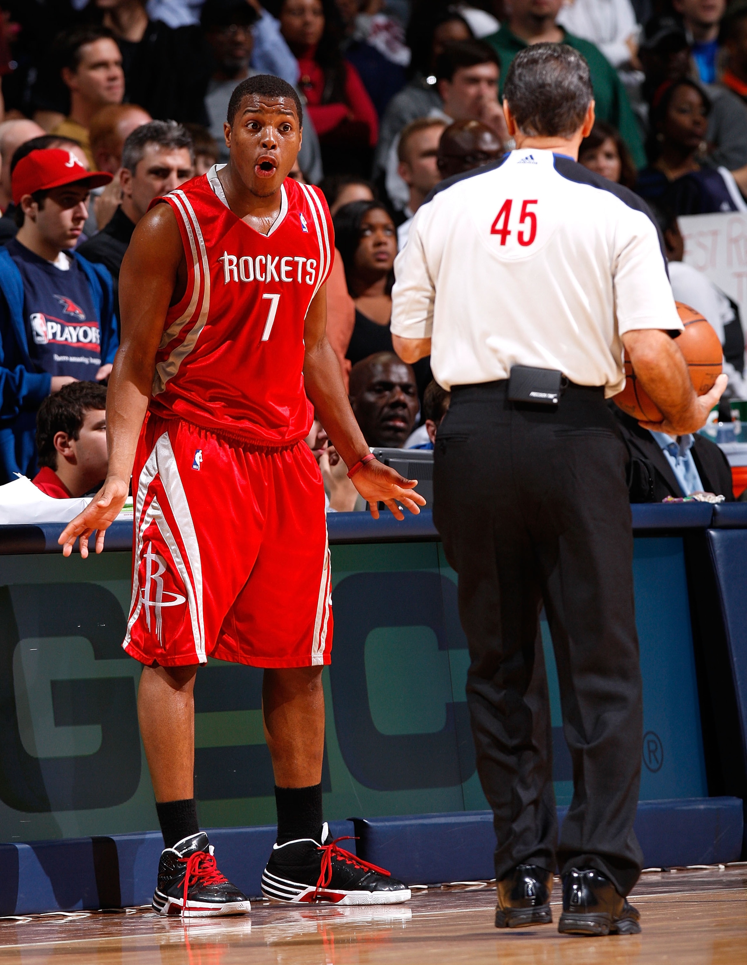ATLANTA - NOVEMBER 20:  Kyle Lowry #7 of the Houston Rockets converses with referee Joe Forte #45 during the game against the Atlanta Hawks at Philips Arena on November 20, 2009 in Atlanta, Georgia.  NOTE TO USER: User expressly acknowledges and agrees th