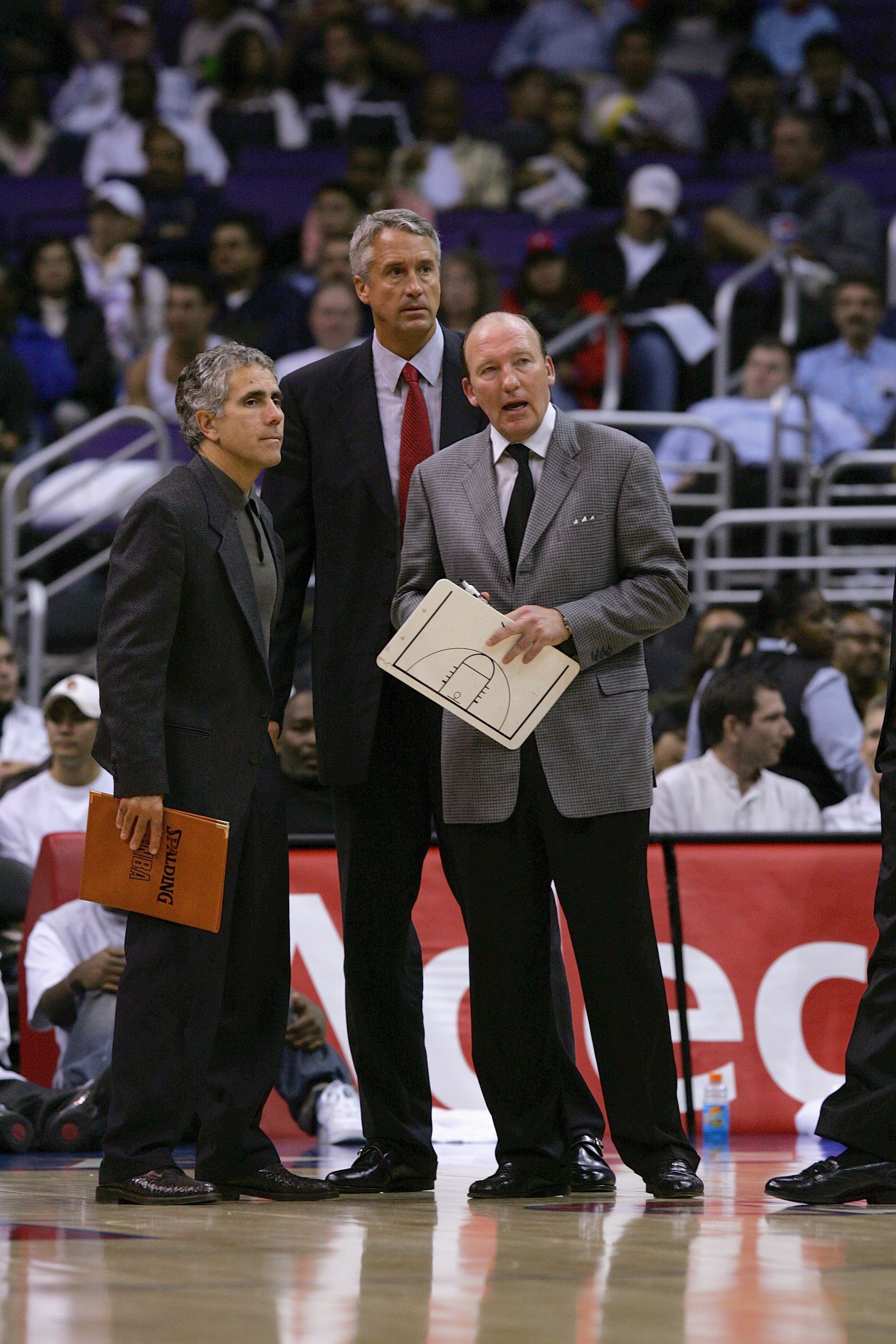 LOS ANGELES - OCTOBER 24: (L-R) Assistant coaches Jim Eyen and Kim Hughes talk with head coach Mike Dunleavy Sr. of the Los Angeles Clippers during a preseason game against the New Orleans Hornets on October 24, 2004 at Staples Center in Los Angeles, Cal LOS ANGELES - OCTOBER 24: (L-R) Assistant coaches Jim Eyen and Kim Hughes talk with head coach Mike Dunleavy Sr. of the Los Angeles Clippers during a preseason game against the New Orleans Hornets on October 24, 2004 at Staples Center in Los Angeles, Cal