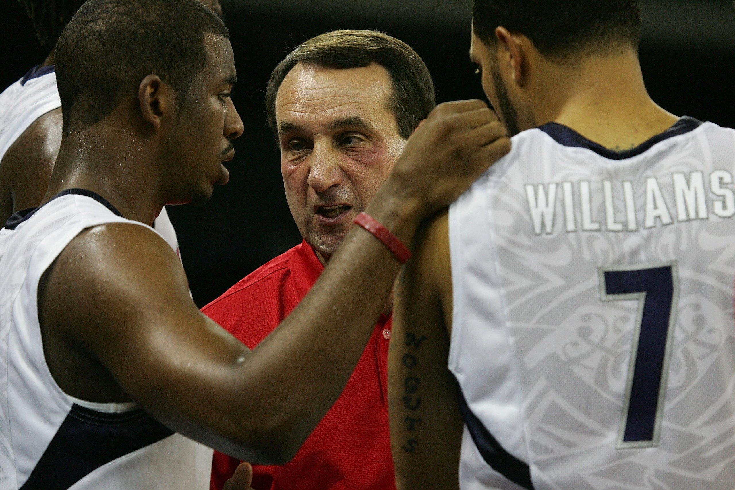 MACAU, CHINA - AUGUST 01:  Head coach Mike Krzyzewski talks with Chris Paul #13 and Deron Williams #7 of the USA Basketball Men's Senior National Team during the USA Basketball International Challenge exhibition game against the Turkey National Team at th