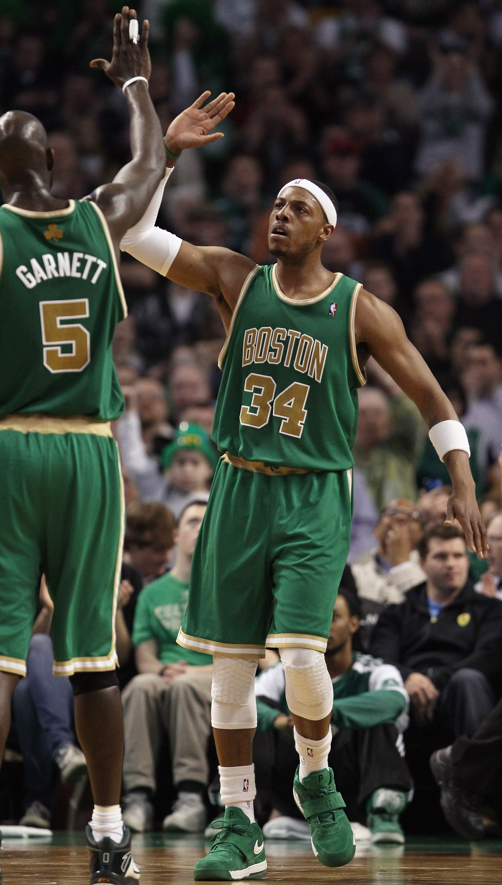 BOSTON, MA - MARCH 16:  Paul Pierce #34 of the Boston Celtics is congratulated by teammate Kevin Garnett #5 after Pierce drew the foul in the second half against the Indiana Pacers on March 16, 2011 at the TD Garden in Boston, Massachusetts. The Celtics d