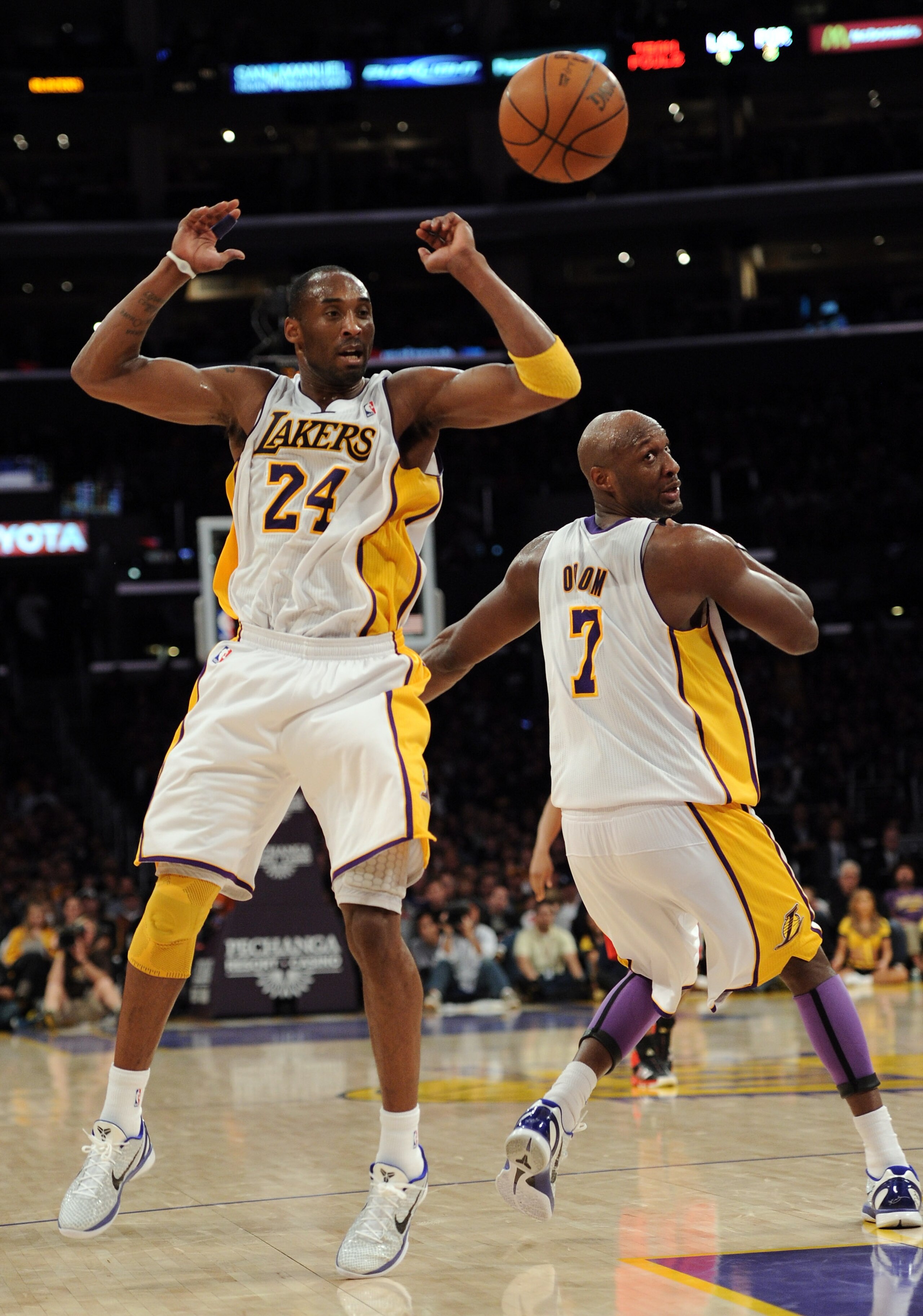 LOS ANGELES, CA - MARCH 20:  Kobe Bryant #24 and Lamar Odom #7 of the Los Angeles Lakers chase after a ball against the Portland Trail Blazers at the Staples Center on March 20, 2011 in Los Angeles, California.  NOTE TO USER: User expressly acknowledges a