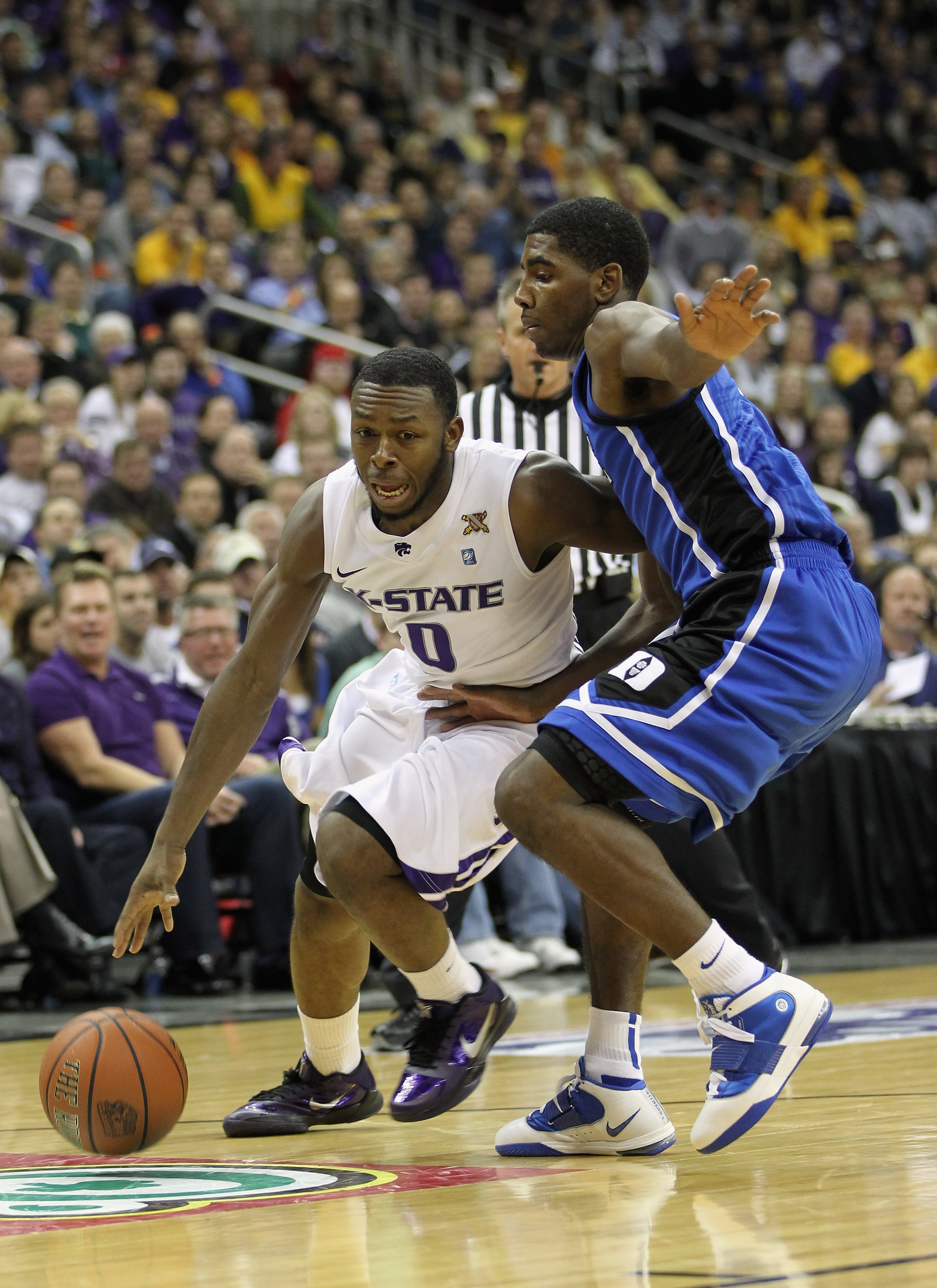 KANSAS CITY, MO - NOVEMBER 23: Jacob Pullen #0 of the Kansas State Wildcats drives as Kyrie Irving #1 of the Duke Blue Devils defends during the CBE Classic championship game on November 23, 2010 at the Sprint Center in Kansas City, Missouri. (Photo by KANSAS CITY, MO - NOVEMBER 23: Jacob Pullen #0 of the Kansas State Wildcats drives as Kyrie Irving #1 of the Duke Blue Devils defends during the CBE Classic championship game on November 23, 2010 at the Sprint Center in Kansas City, Missouri. (Photo by