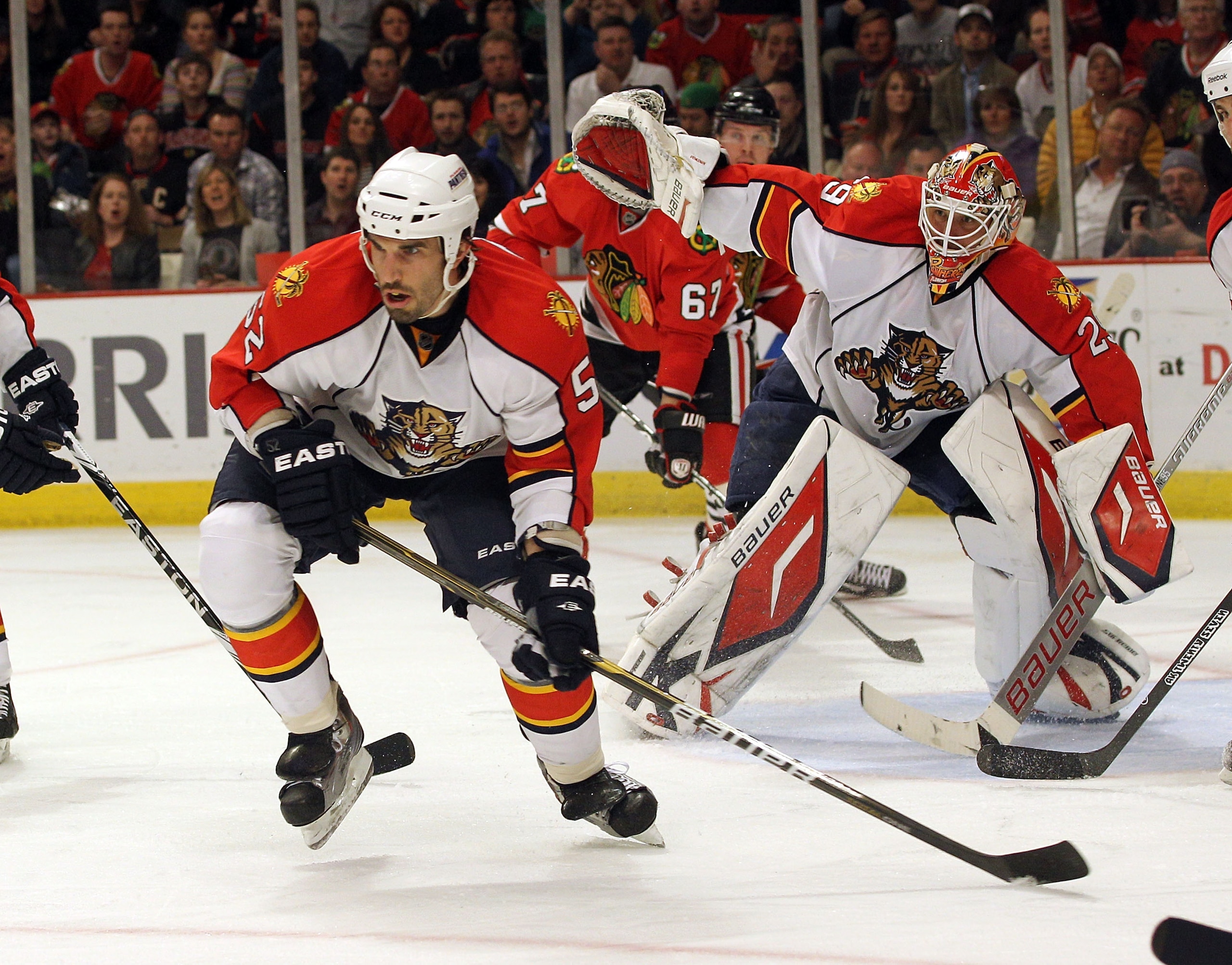 CHICAGO, IL - MARCH 23: Jason Garrison #52  and Tomas Vokoun #29 of the Florida Panthers skate against the Chicago Blackhawks at the United Center on March 23, 2011 in Chicago, Illinois. The Blackhawks defeated the Panthers 4-0.  (Photo by Bruce Bennett/G