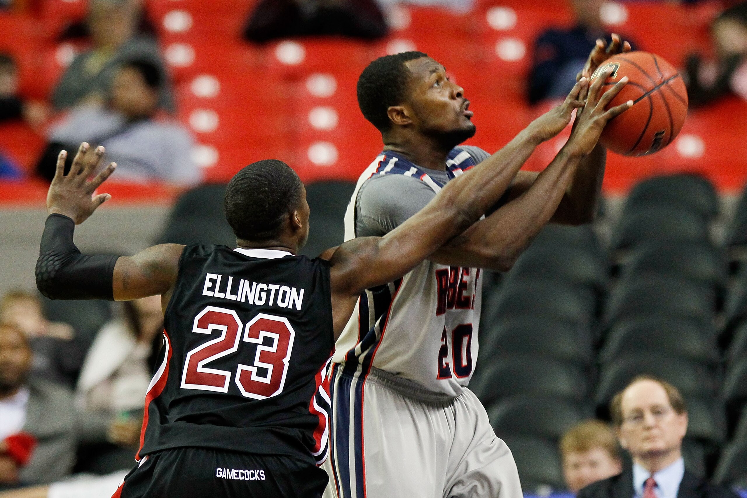 ATLANTA, GA - MARCH 10:  Bruce Ellington #23 of the South Carolina Gamecocks attempts to block a shot by Nick Williams #20 of the Ole Miss Rebels during the first round of the SEC Men's Basketball Tournament at the Georgia Dome on March 10, 2011 in Atlant