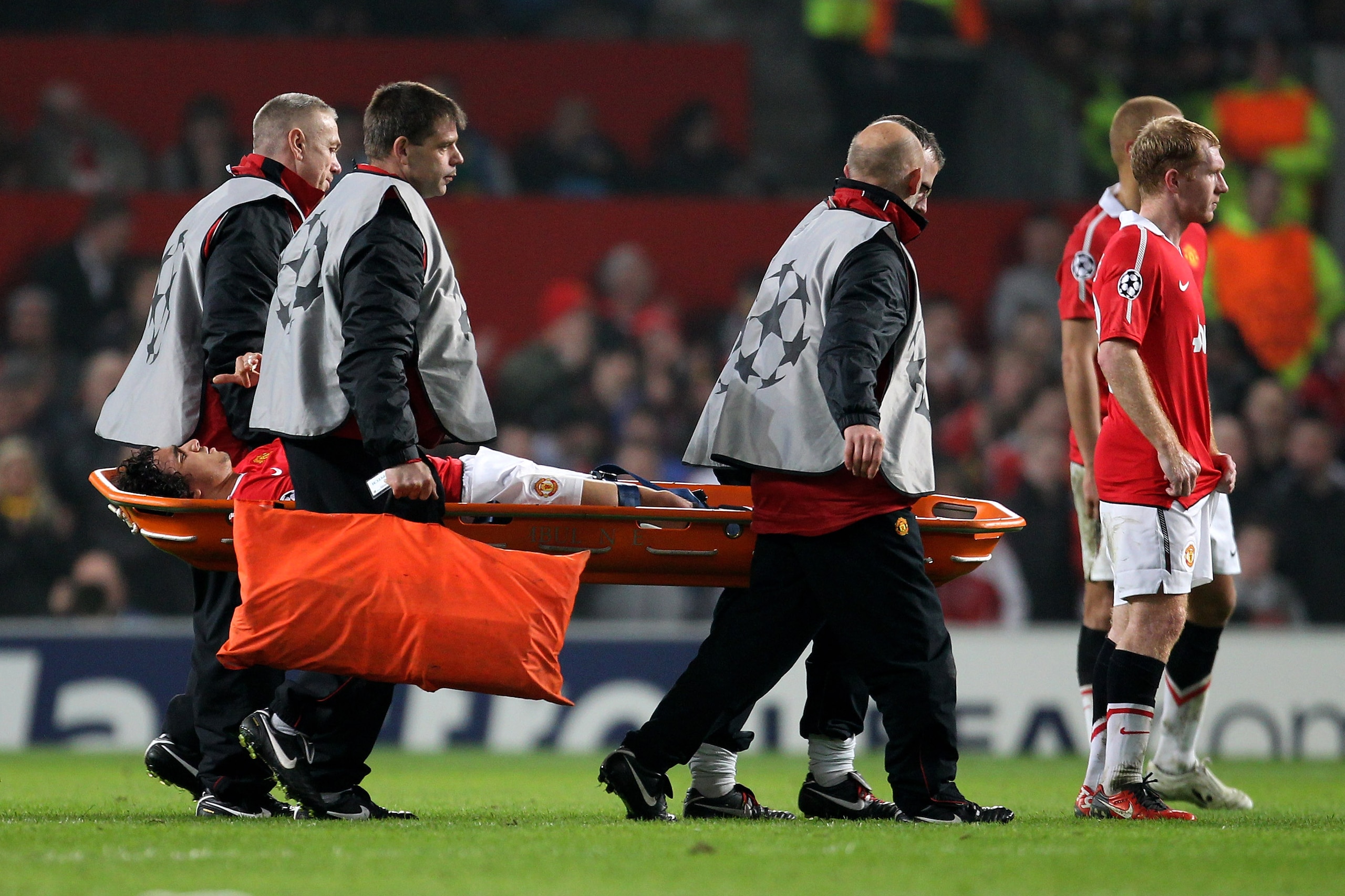 MANCHESTER, ENGLAND - MARCH 15:  Rafael  of Manchester United is stretchered off the pitch injured during the UEFA Champions League round of 16 second leg match between Manchester United and Marseille at Old Trafford on March 15, 2011 in Manchester, Engla