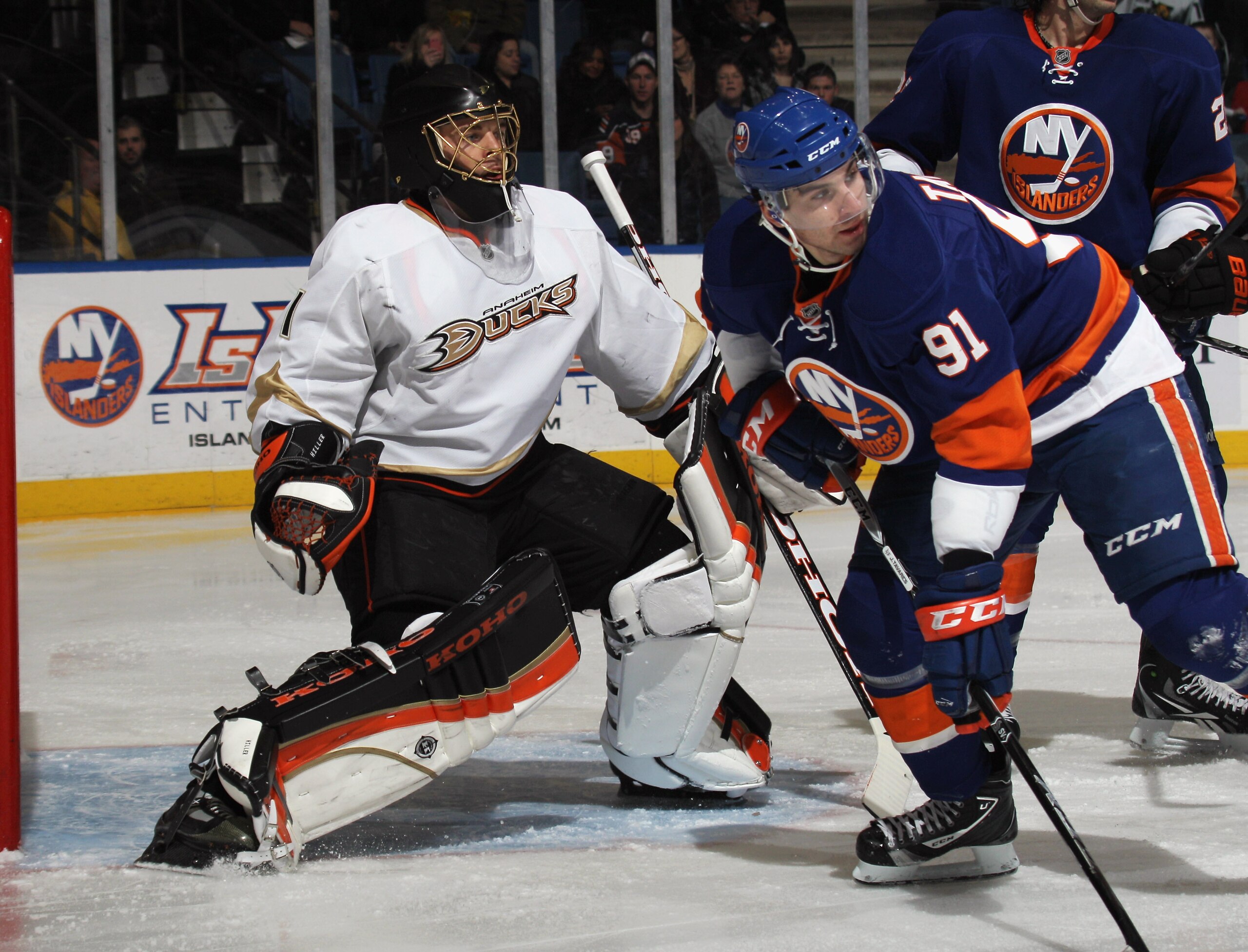 UNIONDALE, NY - DECEMBER 16:  Jonas Hiller #1 of the Anaheim Ducks tends net against John Tavares #91 of the New York Islanders the New York Islanders at the Nassau Coliseum on December 16, 2010 in Uniondale, New York.  (Photo by Bruce Bennett/Getty Image