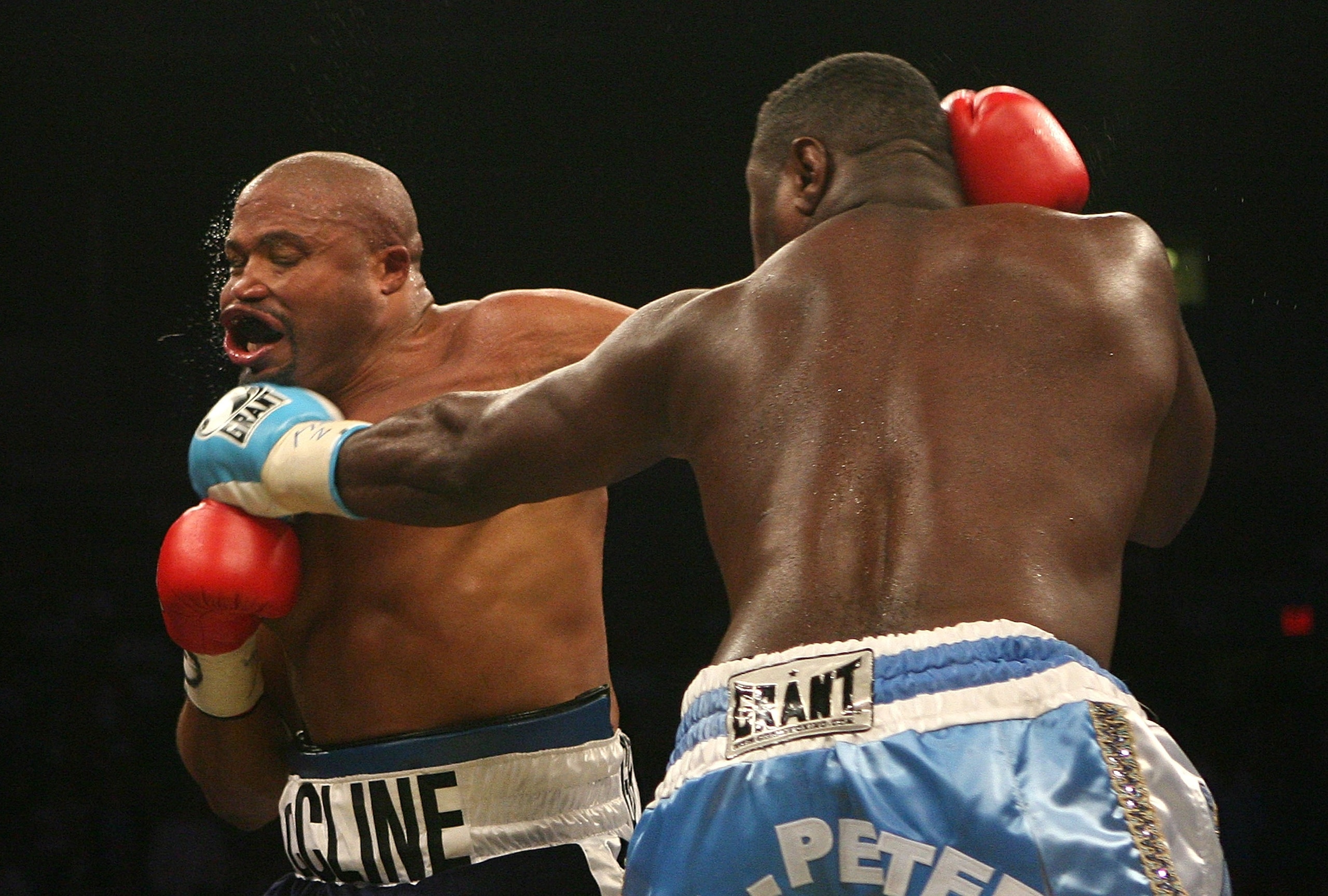 NEW YORK - OCTOBER 06:  Samuel Peter of Nigeria lands a left on Jameel McCline during their WBC Heavyweight Championship bout on October 6, 2007 at Madison Square Garden in New York City.  (Photo by Nick Laham/Getty Images)