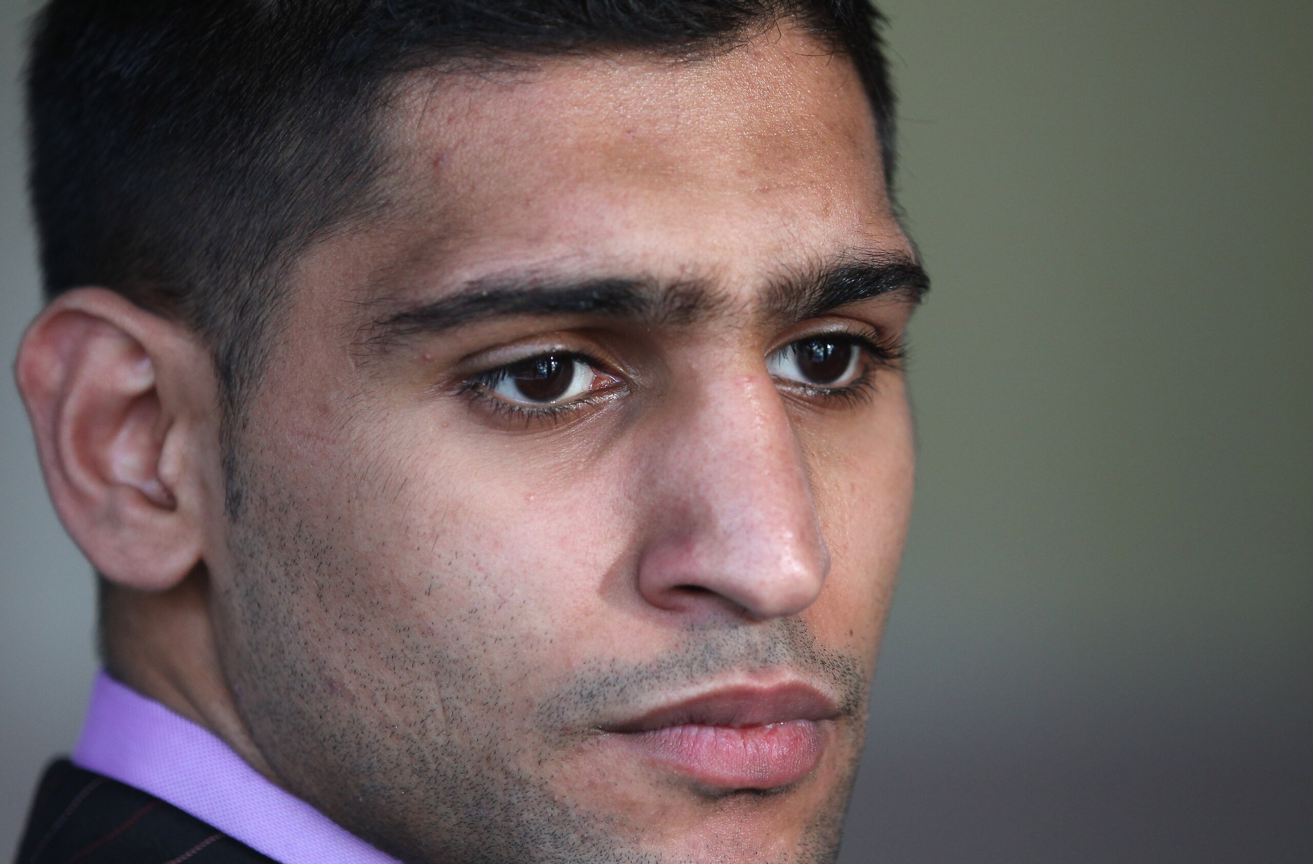 MANCHESTER, ENGLAND - FEBRUARY 08:  Amir Khan faces the media as he announces his next defence of the WBA light-welterweight title against Paul McCloskey at a press conference at the Lowery Hotel on February 8, 2011 in Manchester, England.  (Photo by Alex