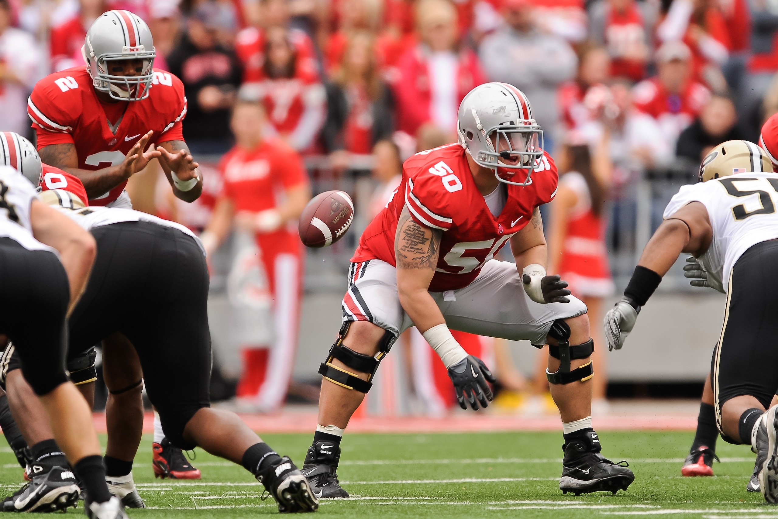 COLUMBUS, OH - OCTOBER 23:  Michael Brewster #50 of the Ohio State Buckeyes blocks against the Purdue Boilermakers at Ohio Stadium on October 23, 2010 in Columbus, Ohio.  (Photo by Jamie Sabau/Getty Images)